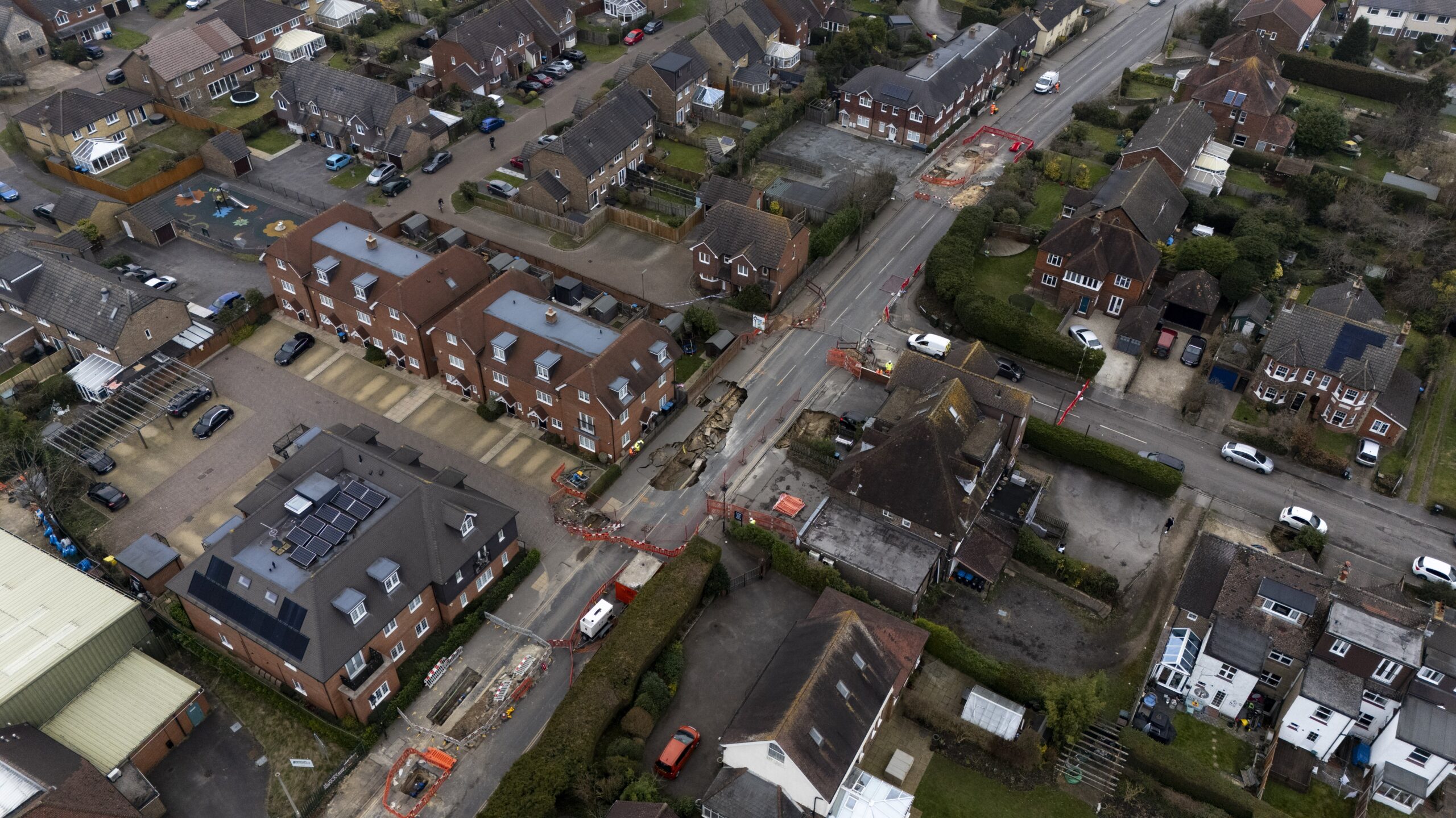 The Surrey village was left with a 20-metre hole in its High Street, which has now been filled