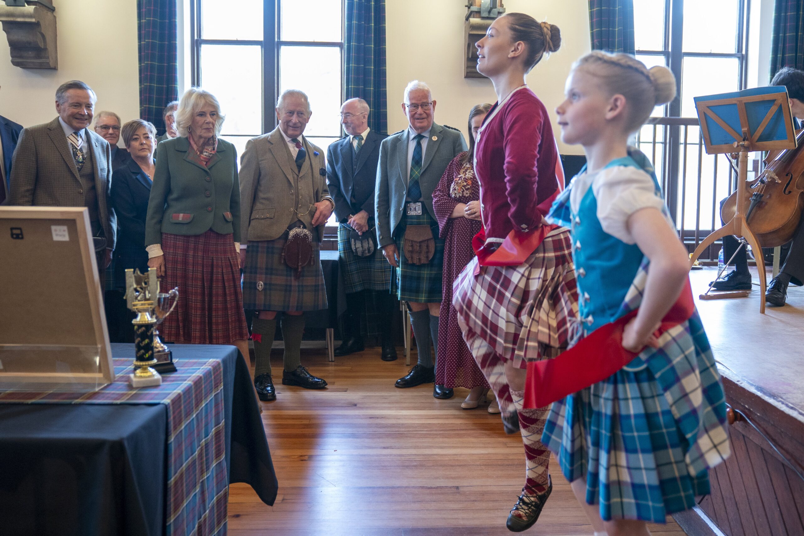 Charles and Camilla watch a Highland dancing performance