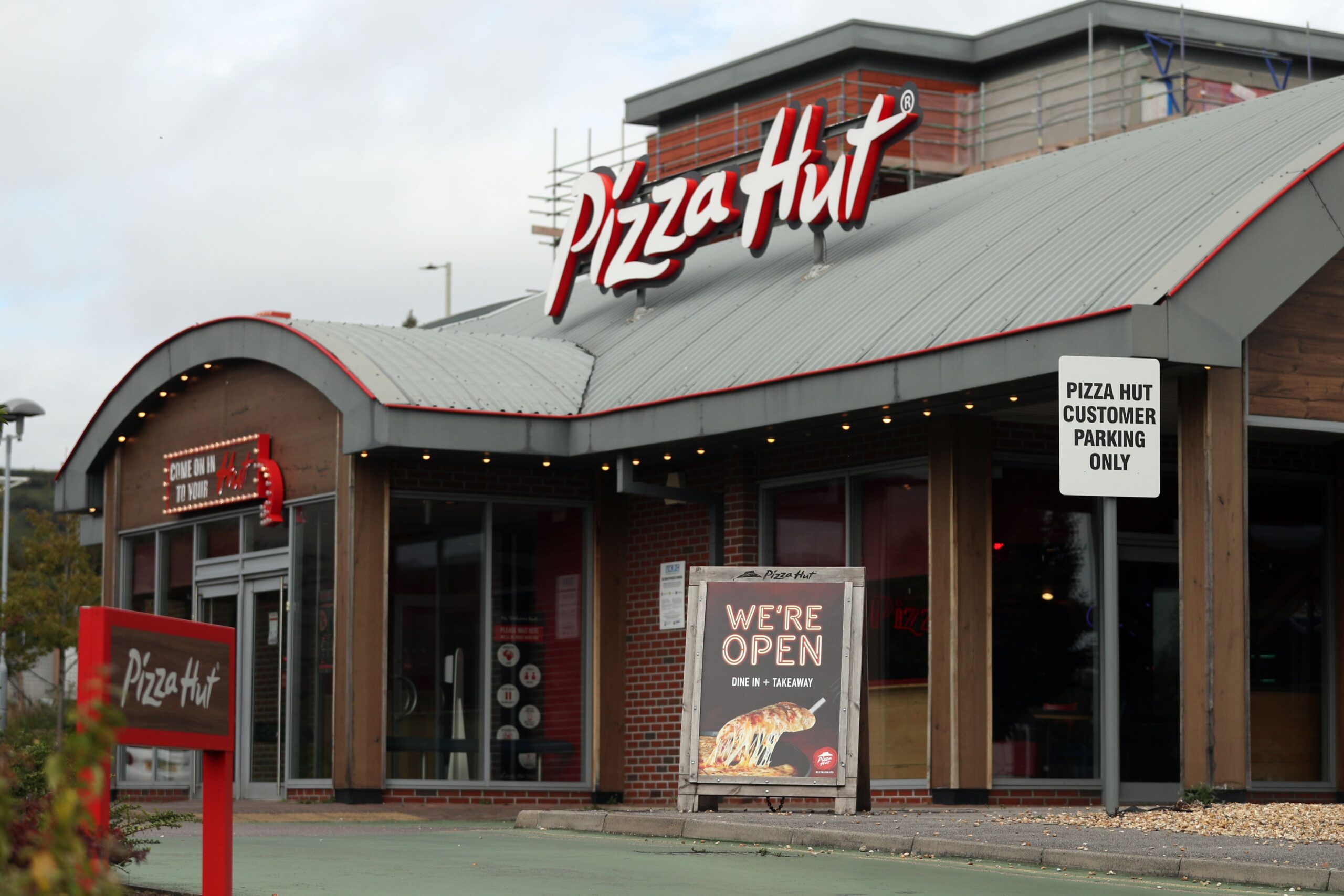 Pizza Hut is to shut 68 restaurants after the company behind its UK restaurants fell into administration (Andrew Matthews/PA)