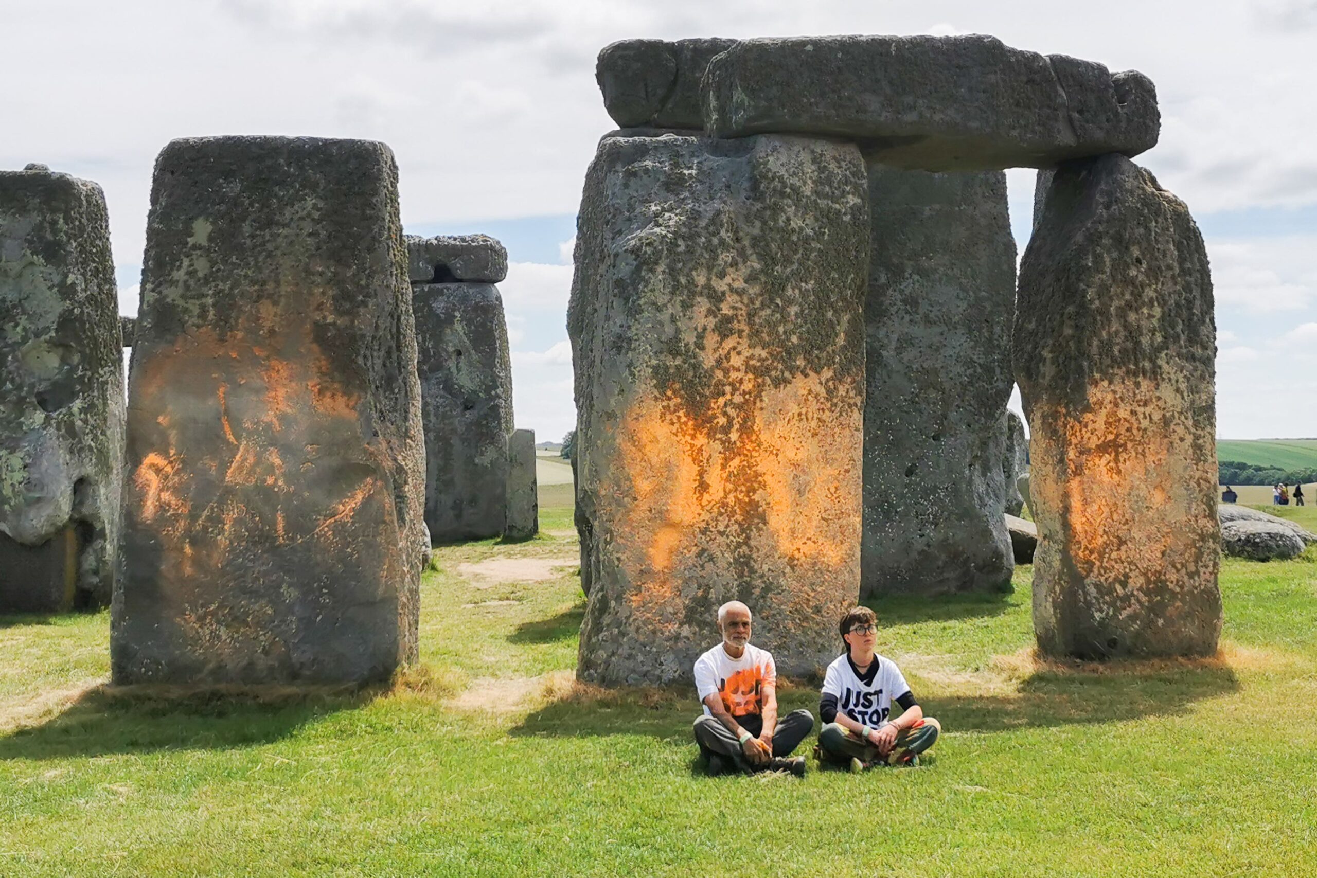 Just Stop Oil protesters sit down after an orange substance was sprayed on Stonehenge