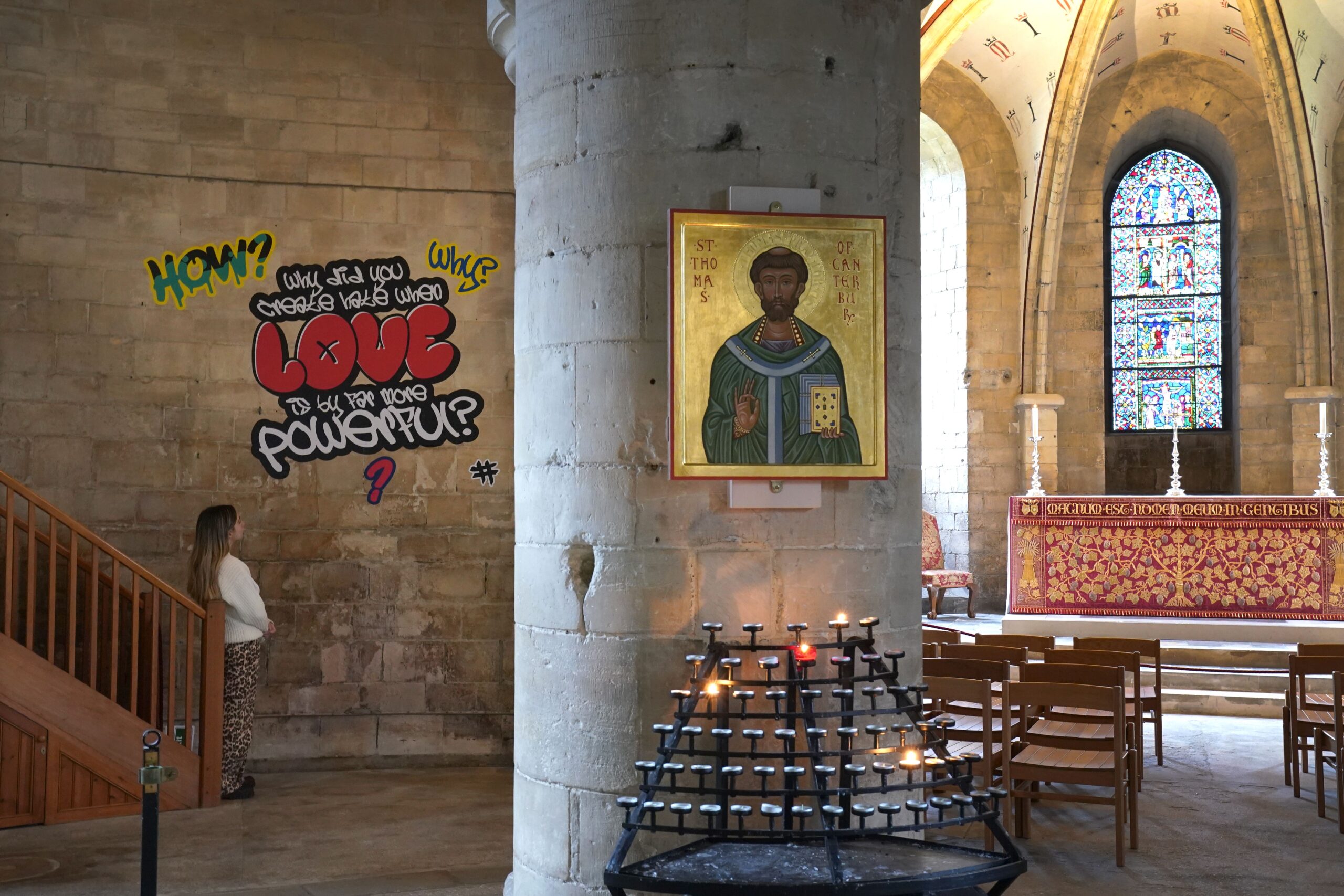 A visitor views graffiti artwork from the Hear Us installation in Canterbury Cathedral (Gareth Fuller/PA)