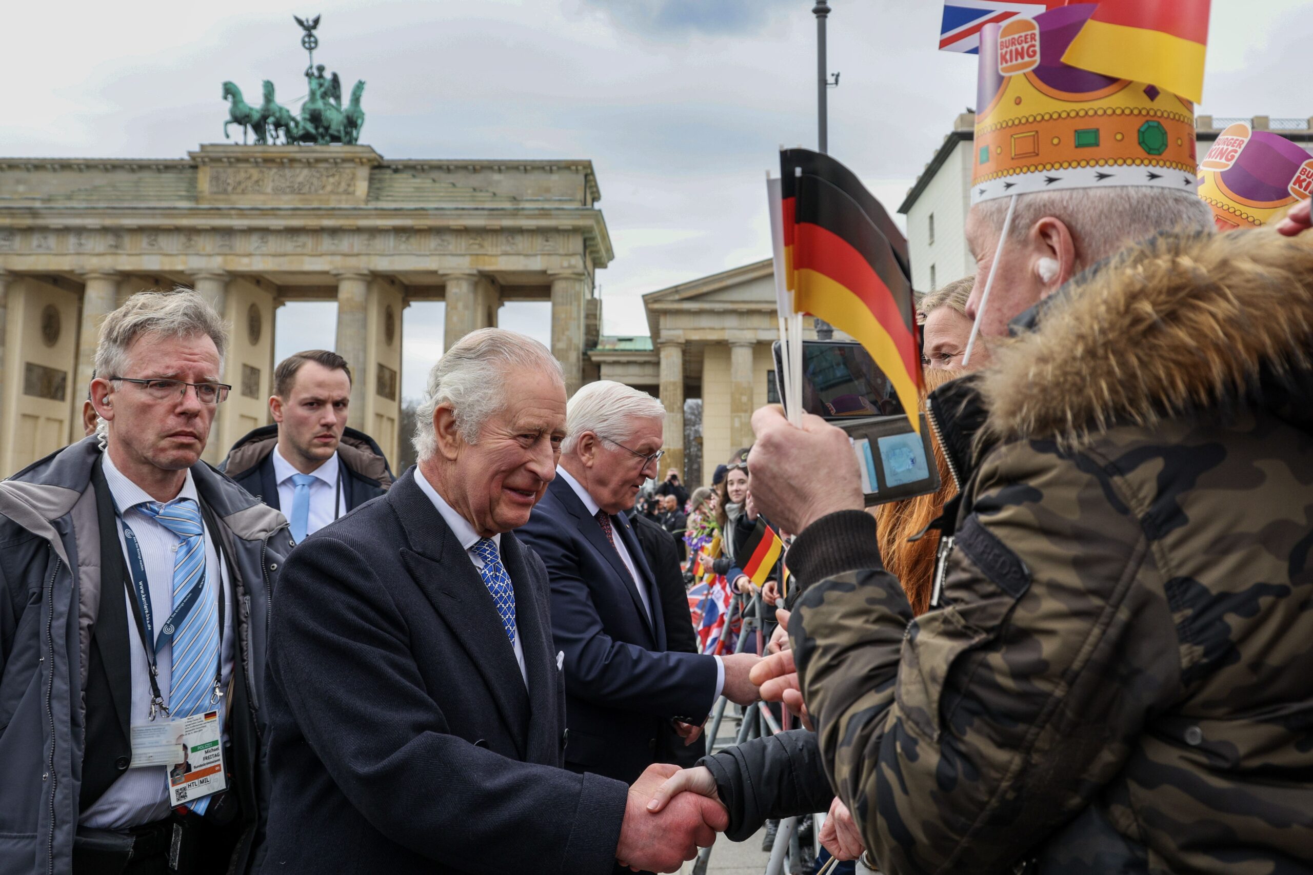 The King and German President Frank-Walter Steinmeier (centre) meet members of the public at the Brandenburg Gate, Berlin, in 2023 (Adrian Dennis/PA)