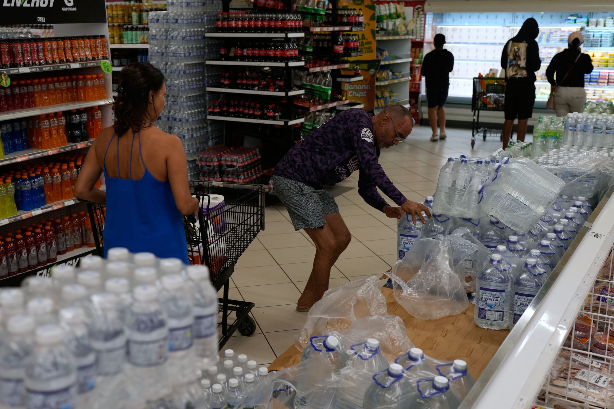 People buy groceries ahead of the forecast arrival of Hurricane Melissa in Kingston, Jamaica, Sunday, Oct. 26, 2025