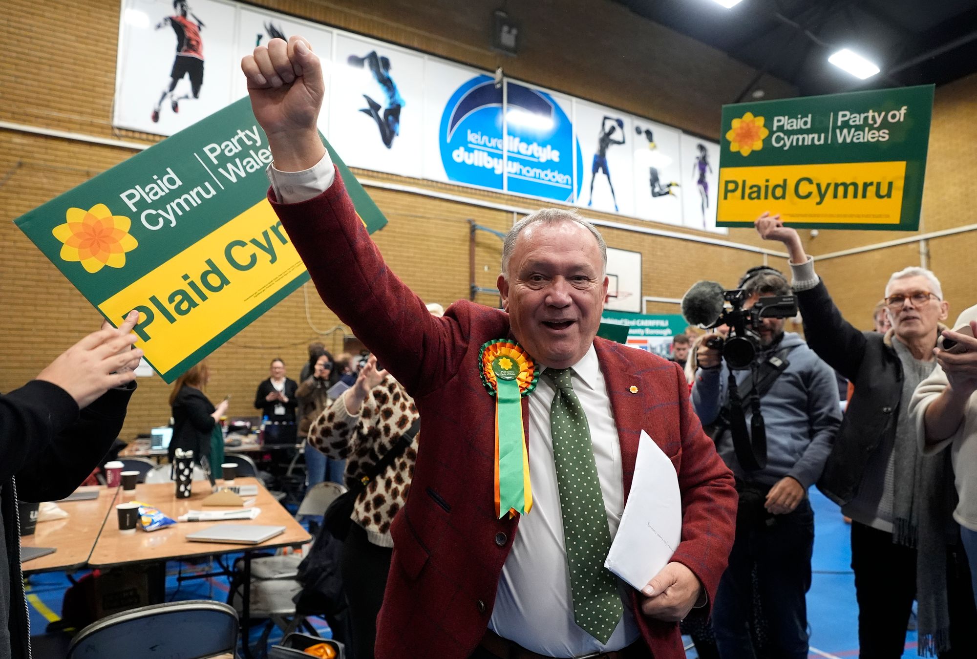 Plaid Cymru's Lindsay Whittle celebrates after being declared winner for the Caerphilly Senedd by-election