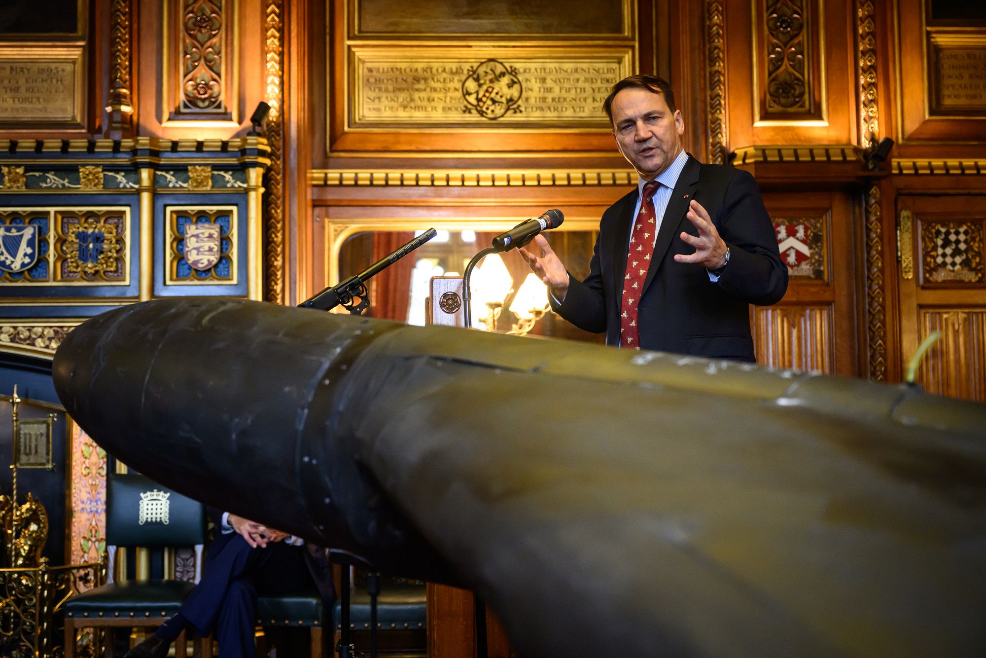 Radek Sikorski, the minister of foreign affairs of Poland, speaks near downed Iranian-made Shahed-136 attack drone, used by Russia in Ukraine, unveiled at the Houses of Parliament in London