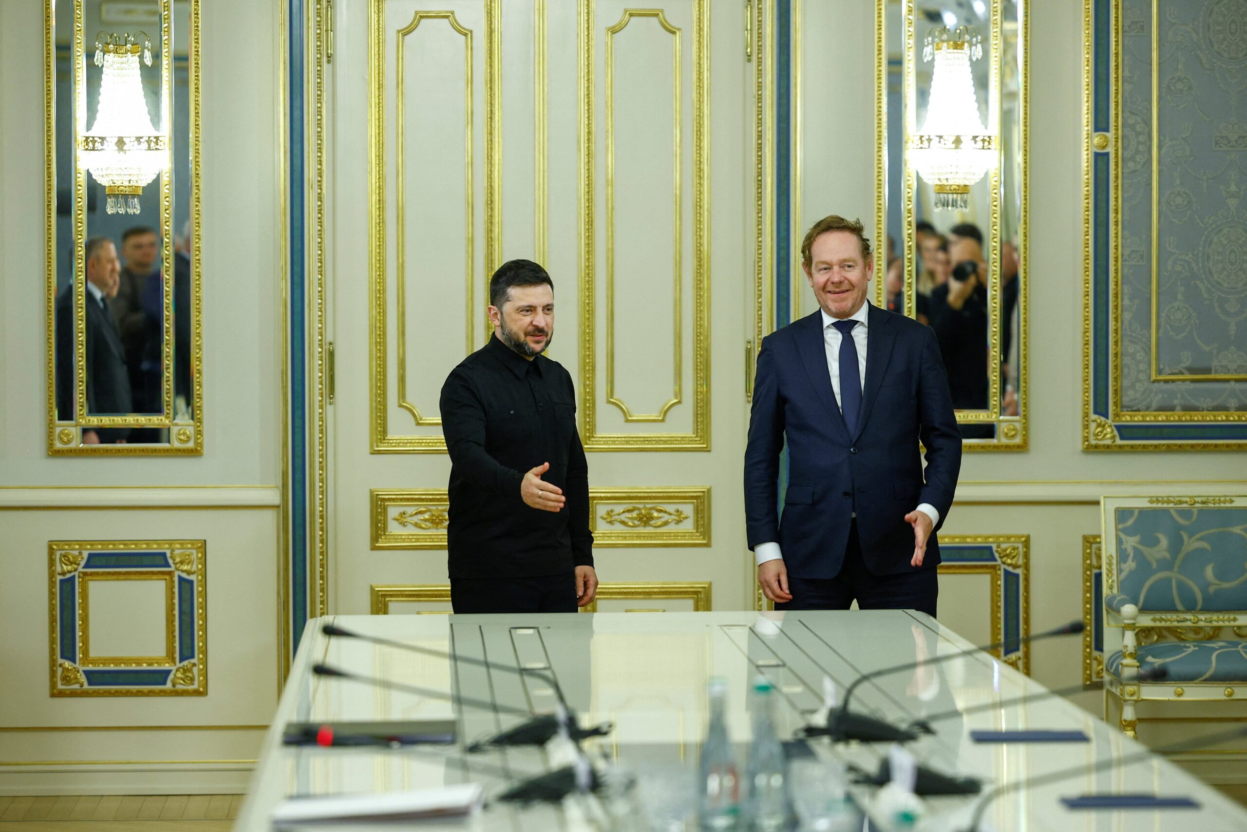 Ukraine's president Volodymyr Zelensky welcomes Dutch foreign minister David van Weel to a meeting