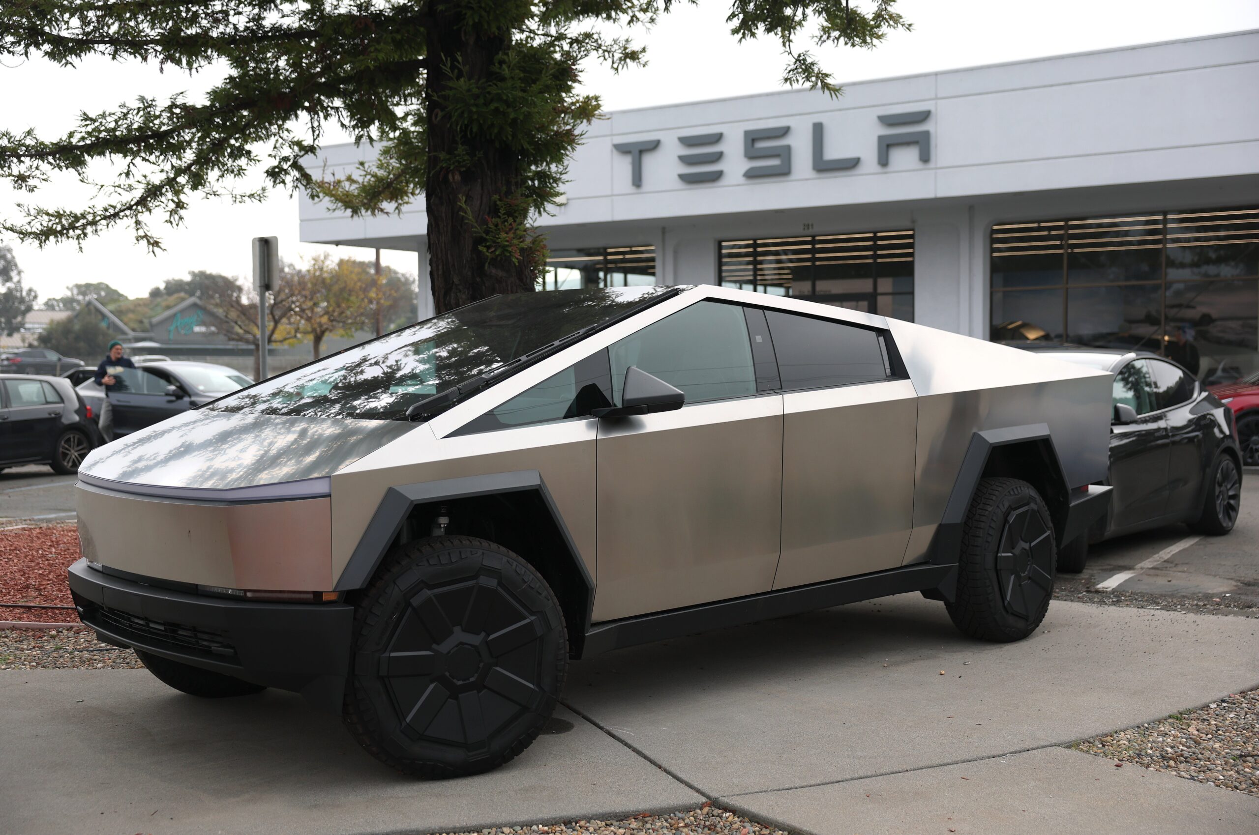 A Tesla Cybertruck owner has publicly shamed a Chicago woman after she was caught on camera smearing dog poop over his Trump-themed car