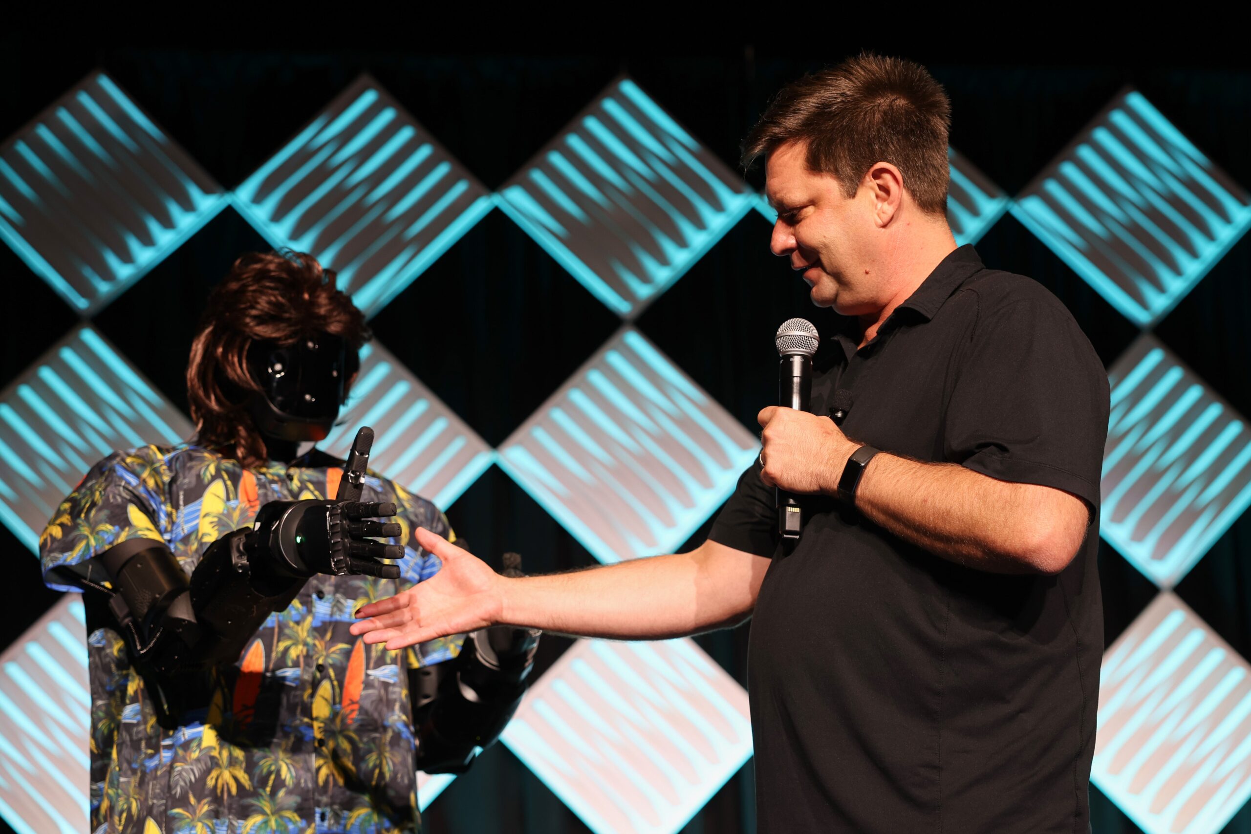 Anduril's outspoken CEO Palmer Luckey appeared via a remotely-piloted robot at the Reindustrialize conference in Detroit this July