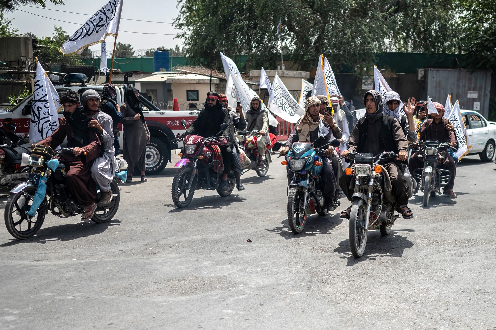 A convoy of Taliban security personnel moves along a street as they celebrate the fourth anniversary of their takeover of Afghanistan in Kabul on August 15, 2025.