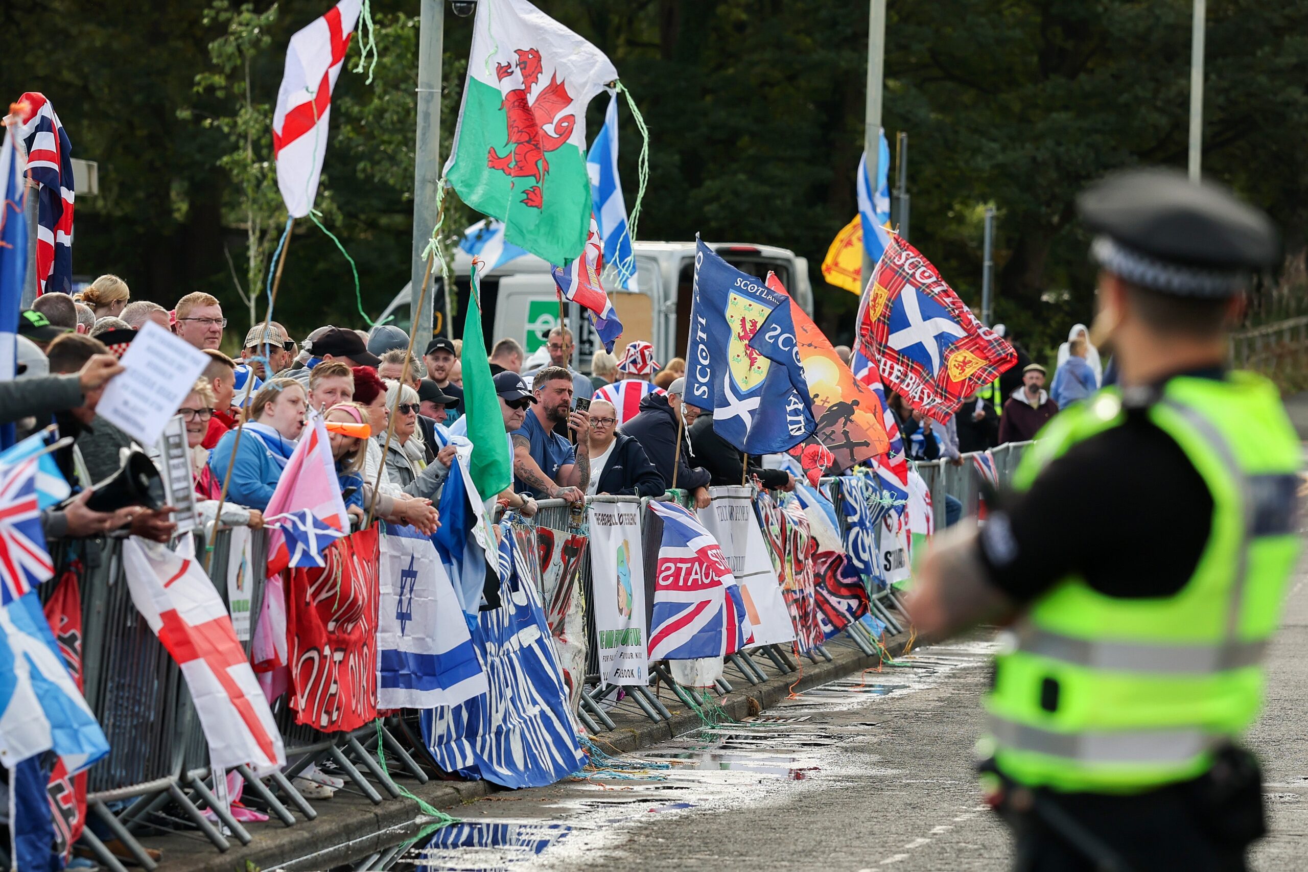 Anti-migrant protesters demonstrate outside the Cladhan Hotel on September 13, 2025 in Falkirk, Scotland.