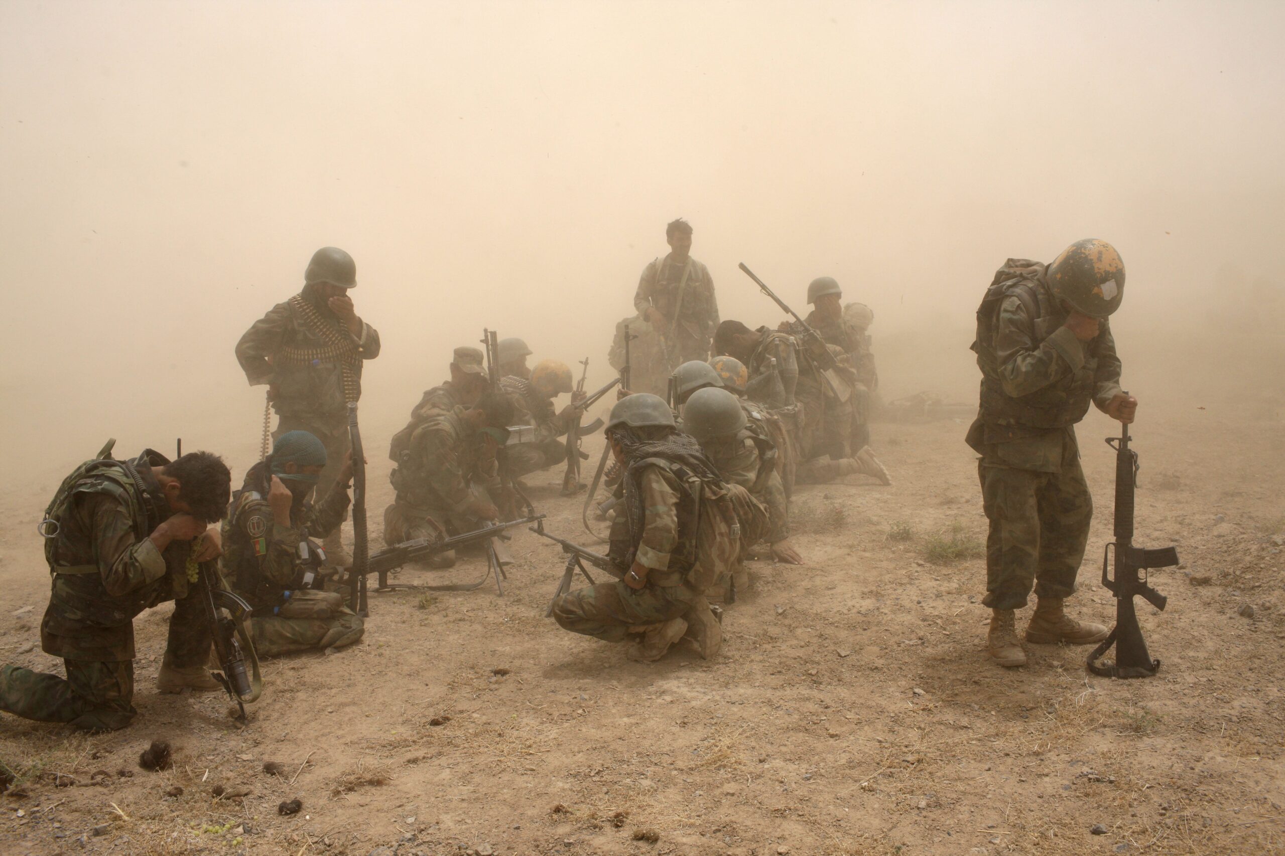Members of the Afghan Security Forces wait to be extracted by helicopter after an operation to search three compounds and look for weapons on July 1, 2008 in Salavat, Panjawi Province, Afghanistan