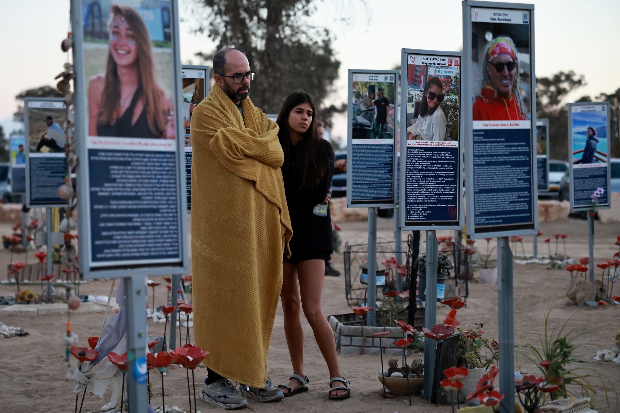 People gather at the former site of the Nova music festival to commemorate the second anniversary of the 7 October attacks