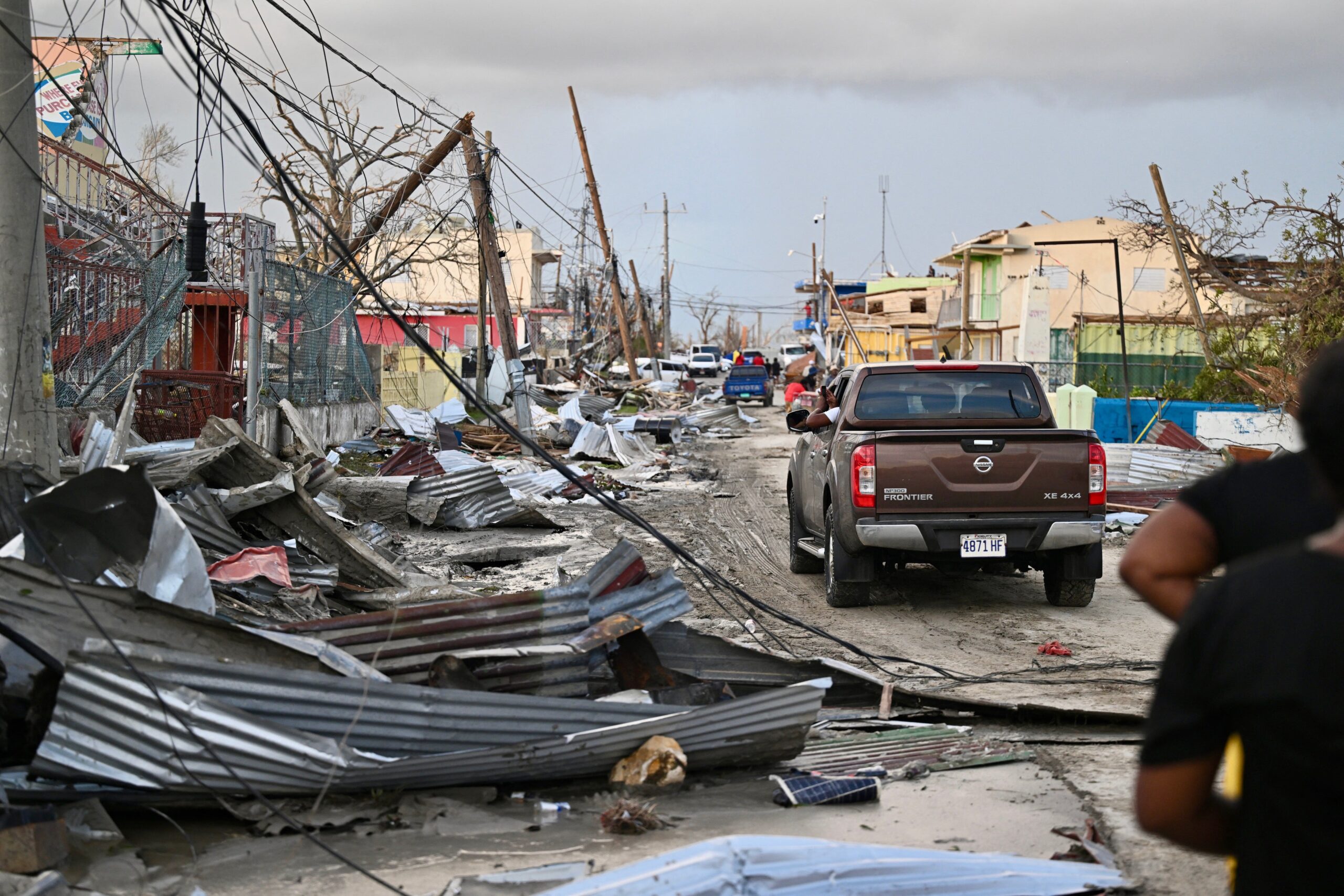 A car drives through the a destroyed neighborood following the passage of Hurricane Melissa, in Black River, Jamaica