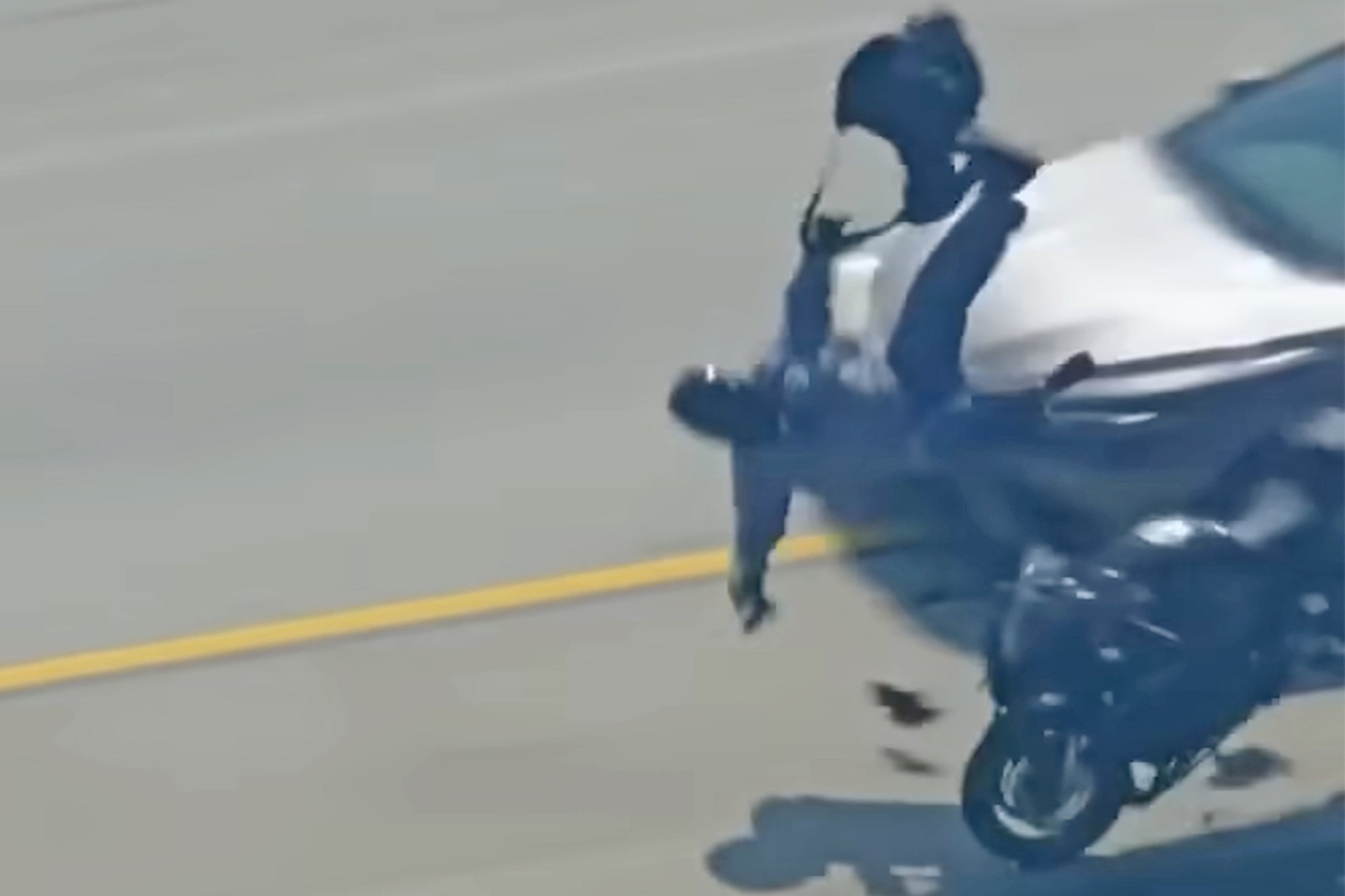 The rider was clipped by a sedan and fell off the bike during pursuit