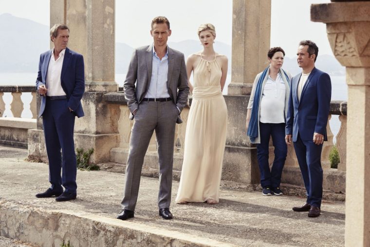 Tom Hiddleston (second left) is effortlessly suave as a hotel concierge turned sleuth, starring alongside (left to right) Hugh Laurie, Elizabeth Debicki, Olivia Colman and Tom Hollander (Photo: Mitch Jenkins/ The Ink Factory /BBC)