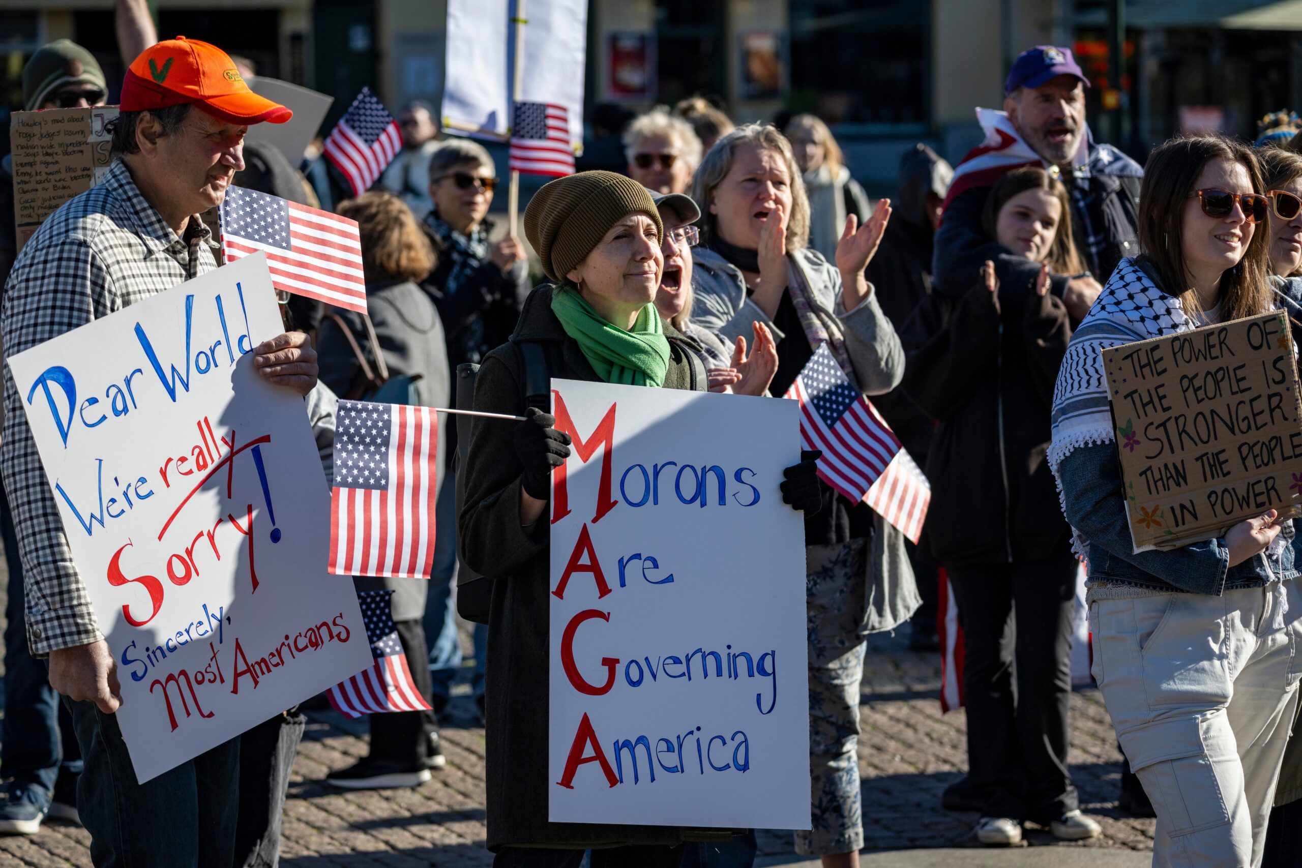 People take part in a No Kings protest, in Malmö, Sweden, Saturday, Oct. 18, 2025. (Johan Nilsson/TT News Agency via AP)