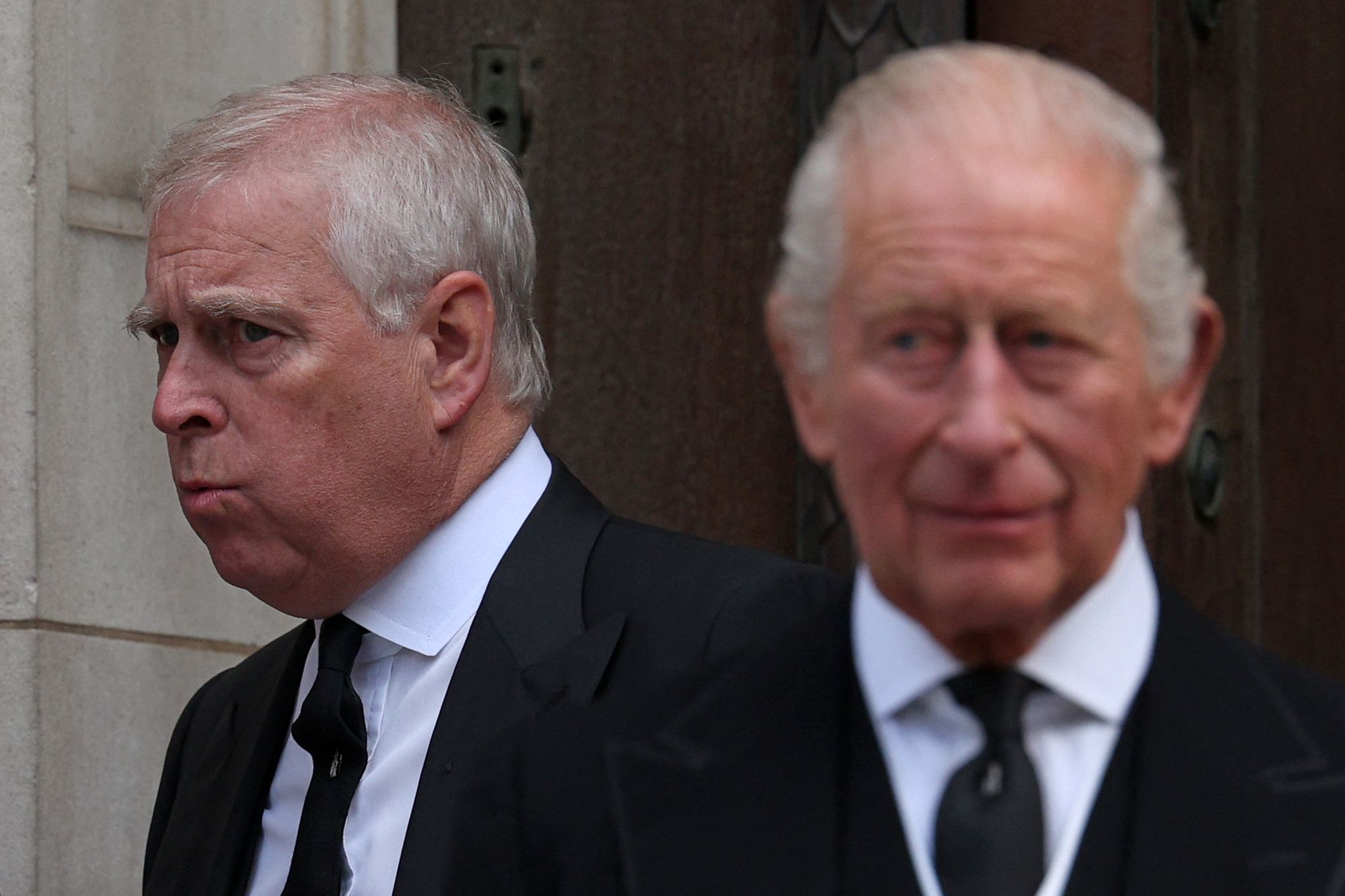 Britain's Prince Andrew, Duke of York (L) and Britain's King Charles III leave following a Requiem Mass, a Catholic funeral service, for the late Katharine, Duchess of Kent, at Westminster Cathedral in London on September 16, 2025