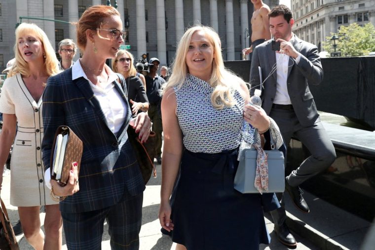 FILE PHOTO: Virginia Giuffre, an alleged victim of Jeffrey Epstein, walks after the hearing in the criminal case against Epstein, who died in what a New York City medical examiner ruled a suicide, at Federal Court in New York, U.S., August 27, 2019. REUTERS/Shannon Stapleton/File Photo 14652061