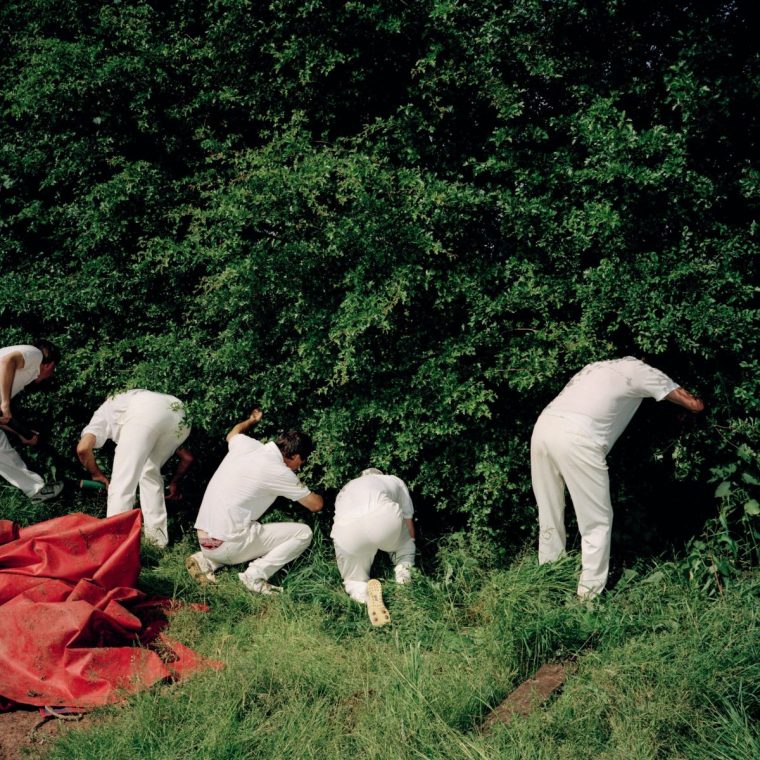 Cricket players looking for cricket ball in a photo from 1992, part of Martin Parr's series Chew Stoke: A Year In The Life Of An English Village (Photo: Martin Parr /Magnum)