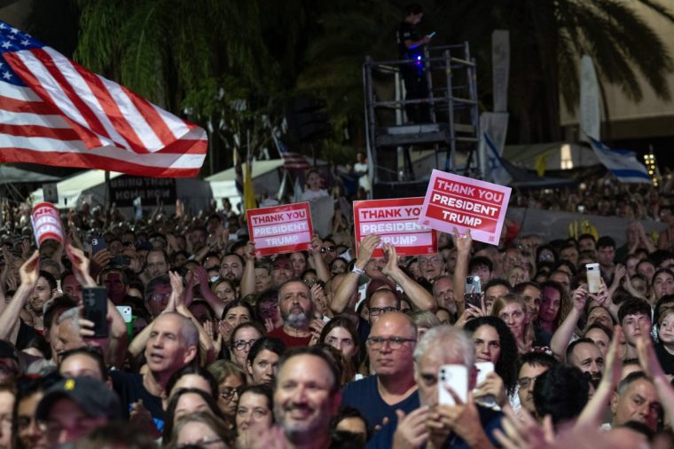 TEL AVIV, ISRAEL - OCTOBER 11: Israelis gather at Hostages Square in Tel Aviv to celebrate the ceasefire agreement in Gaza, waving Israeli and U.S. flags during the celebration in Tel Aviv, Israel on October 11, 2025. The event was attended by U.S. President Donald Trump's his son-in-law, US President Trump's daughter Ivanka Trump and former adviser Jared Kushner and U.S. President Donald Trump's Middle East Special Envoy Steve Witkoff. (Photo by Mostafa Alkharouf/Anadolu via Getty Images)