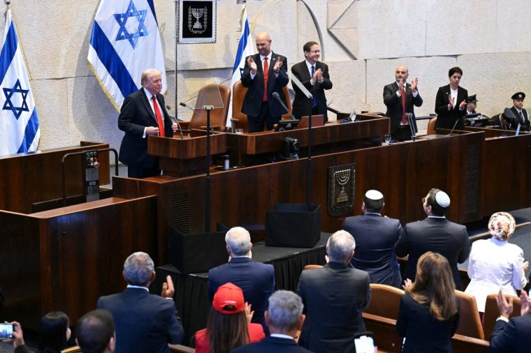 President Donald Trump speaks to the Knesset, Israel's parliament, as Amir Ohana, Speaker of the Israeli Knesset, and Israeli President Isaac Herzog look on, Monday, Oct. 13, 2025 in Jerusalem. (Saul Loeb/Pool via AP)