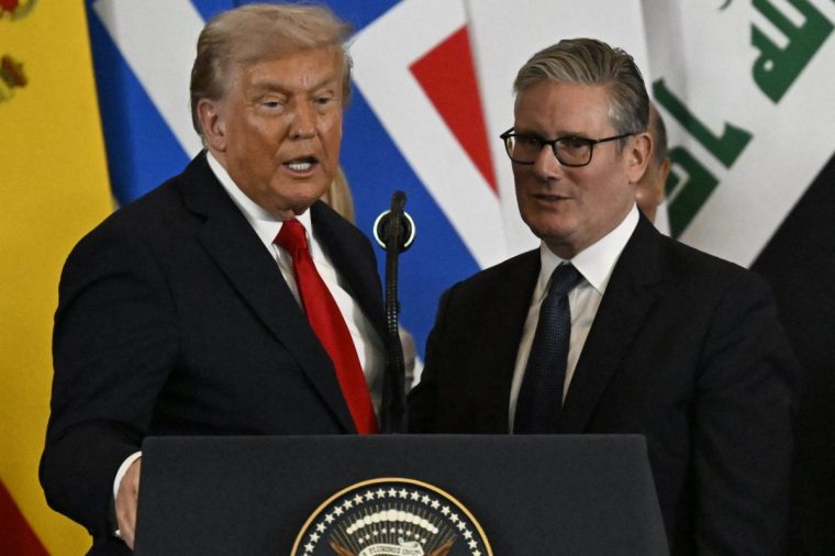US President Donald Trump stands next to Britain's Prime Minister Keir Starmer as he delivers a statement during a summit on Gaza in Sharm el-Sheikh on October 13, 2025. Trump landed in Egypt on October 13 for a summit on Gaza, following a lightning visit to Israel after a ceasefire he brokered entered into force. (Photo by Khaled DESOUKI / AFP) (Photo by KHALED DESOUKI/AFP via Getty Images)