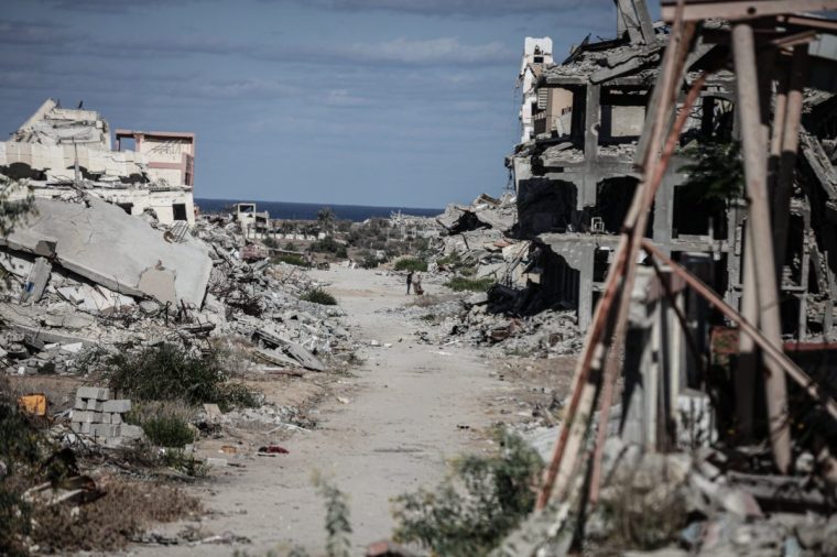 GAZA CITY, GAZA - OCTOBER 14: Destroyed buildings and rubble are seen as displaced Palestinians return to the al-Zahra area in central Gaza City, Gaza following the withdrawal of Israeli forces on October 14, 2025. After the ceasefire takes effect, civilians discover widespread destruction, with entire residential blocks and high-rise buildings reduced to ruins. (Photo by Moiz Salhi/Anadolu via Getty Images)