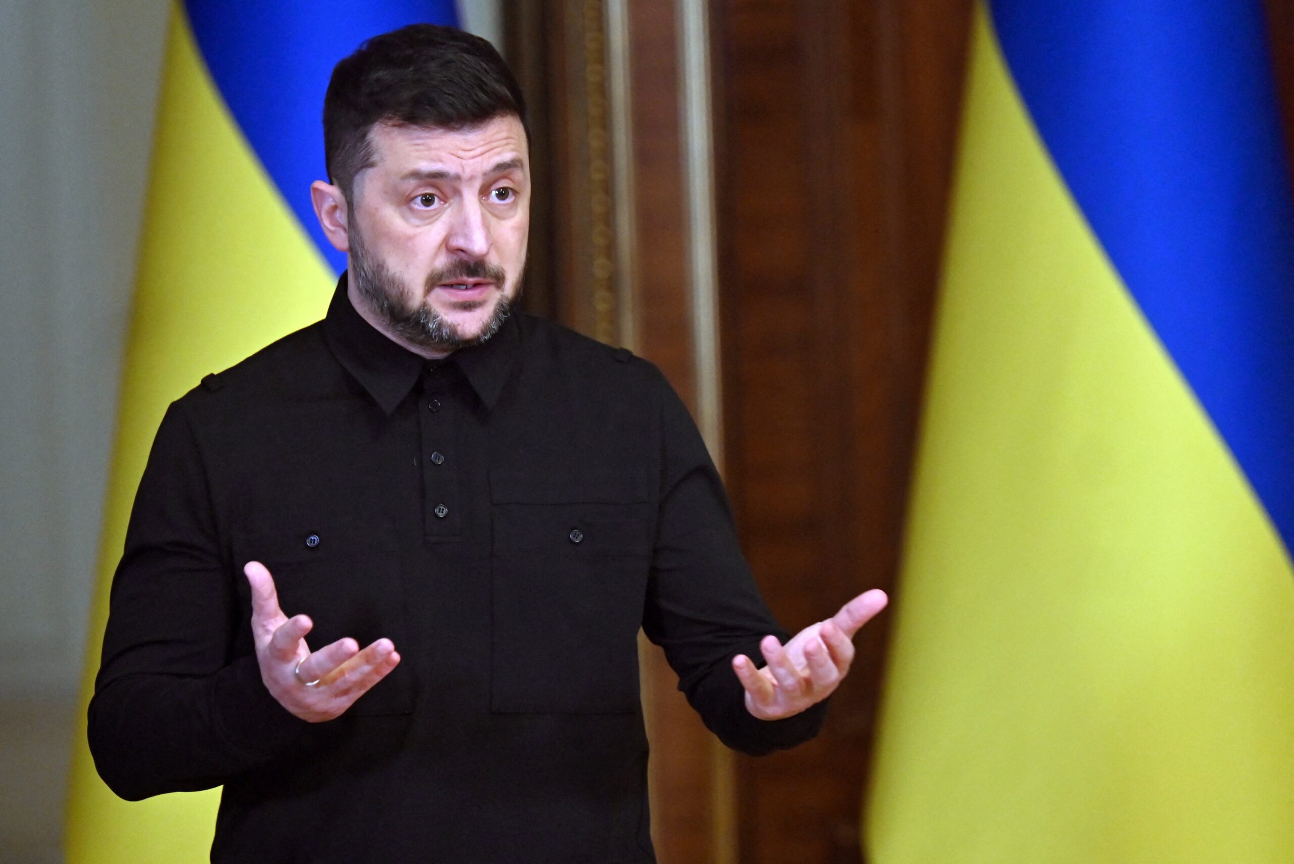 Ukraine’s president Volodymyr Zelensky reacts as he holds a joint press-conference