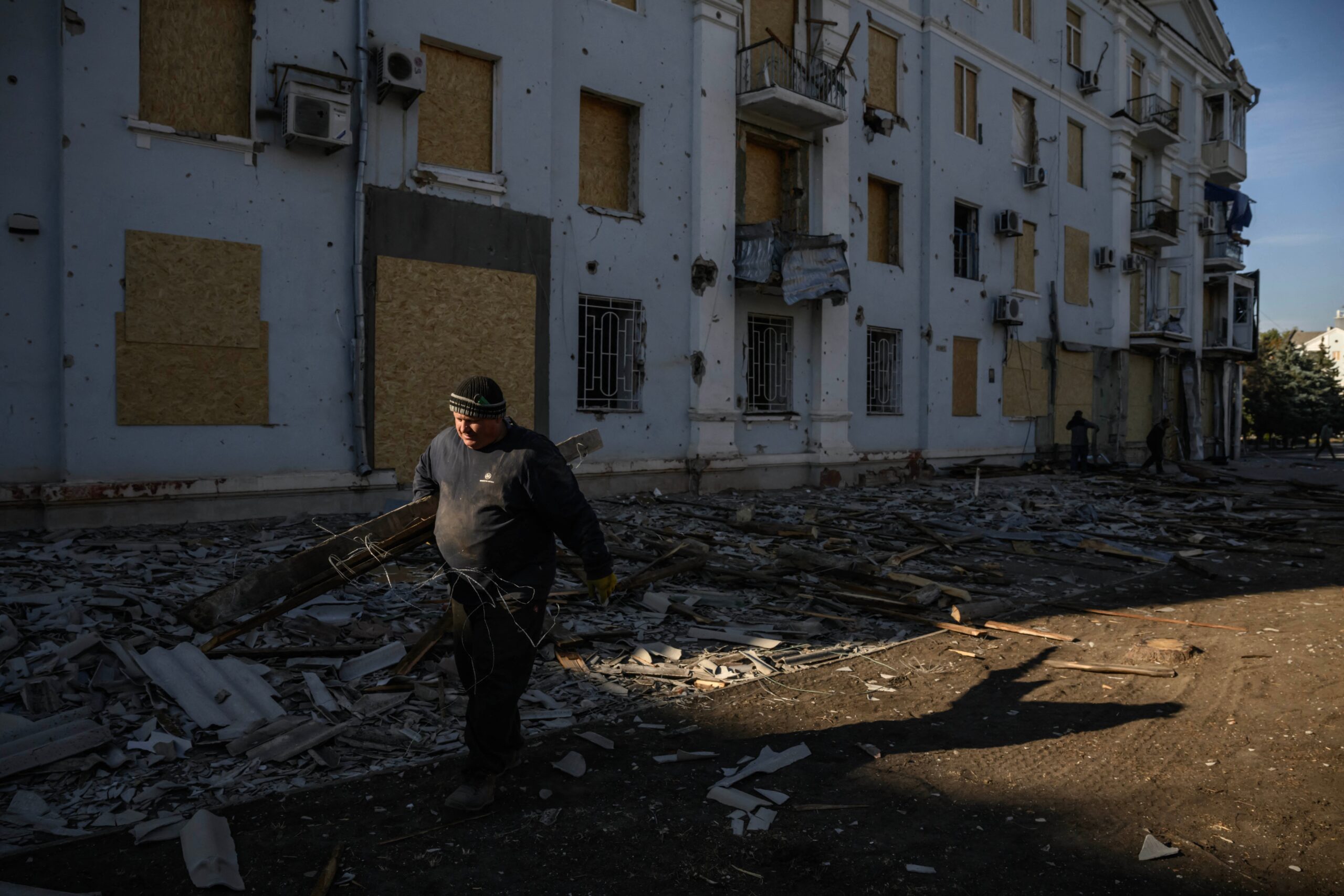 A man salvages wood from a building damaged in a recent Russian strike, in Kramatorsk, eastern Ukraine on 2 October 2025