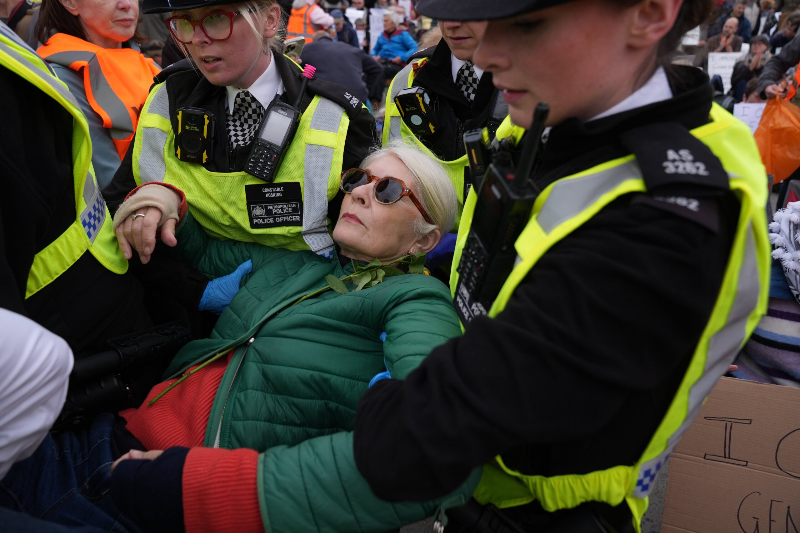 Police remove protesters taking part in a demonstration organised by Defend our Juries, in support of Palestine Action in Trafalgar Square on Saturday