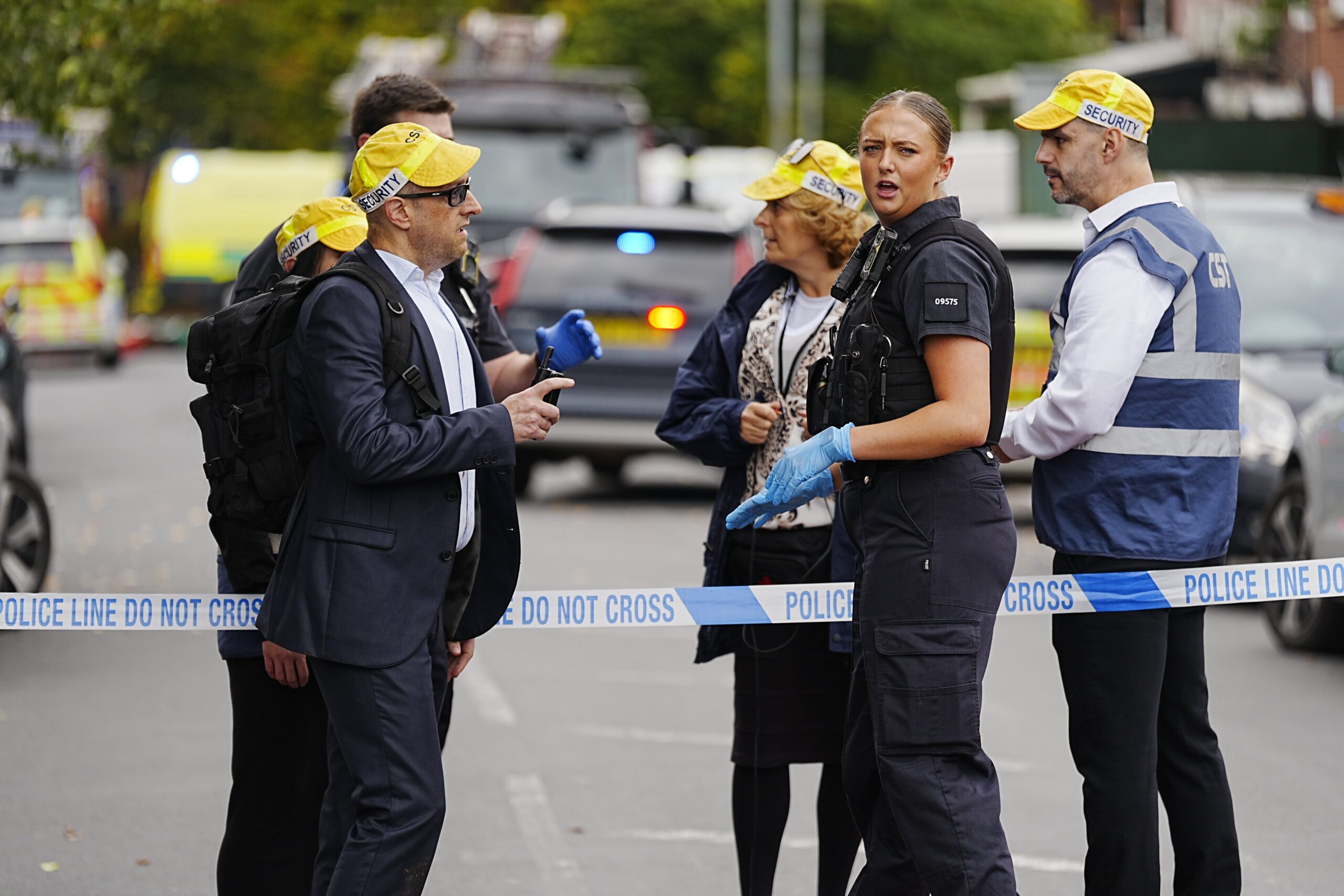 People gather at the cordon in Crumpsall