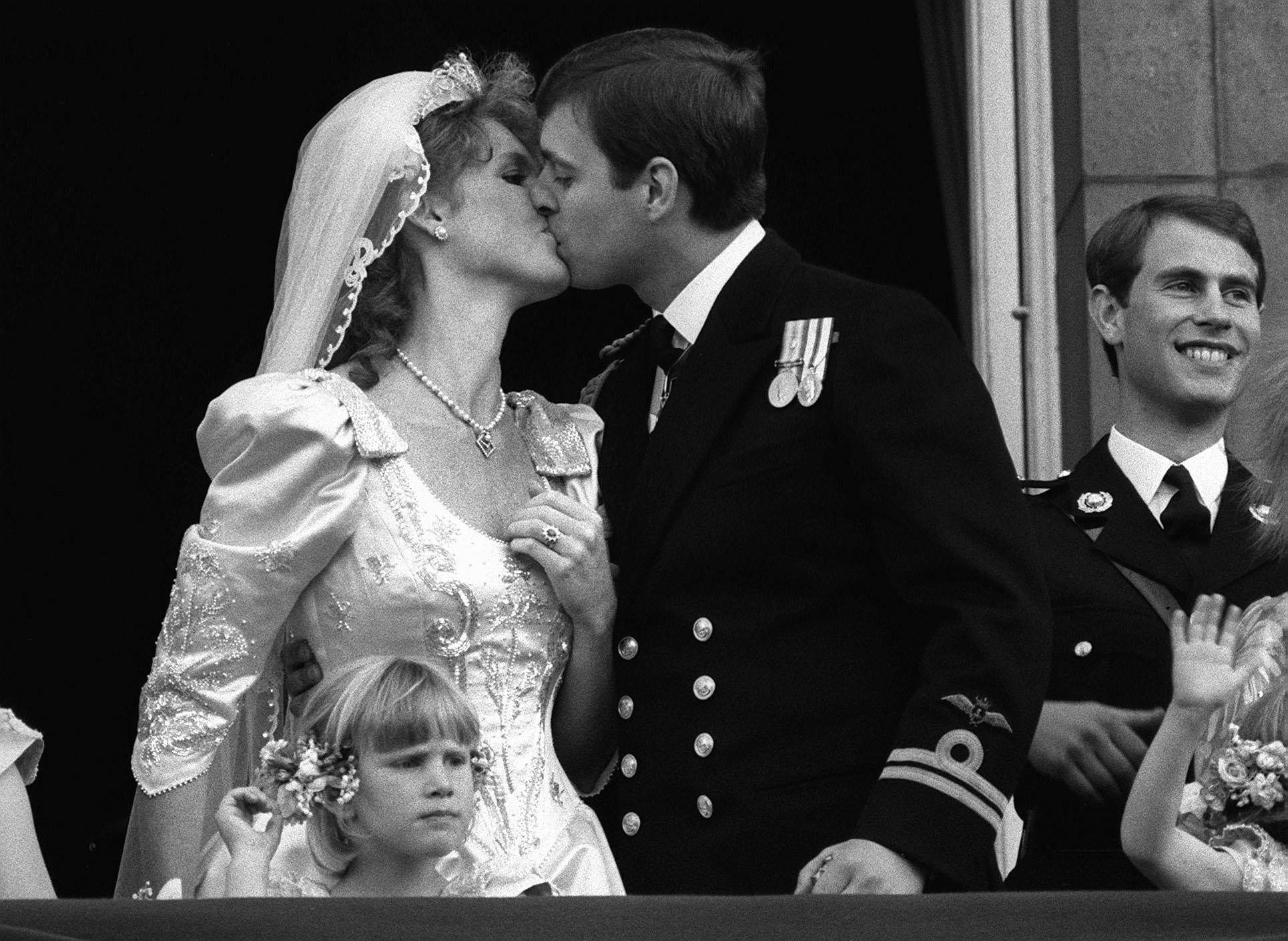 Andrew and Sarah kiss on their wedding day