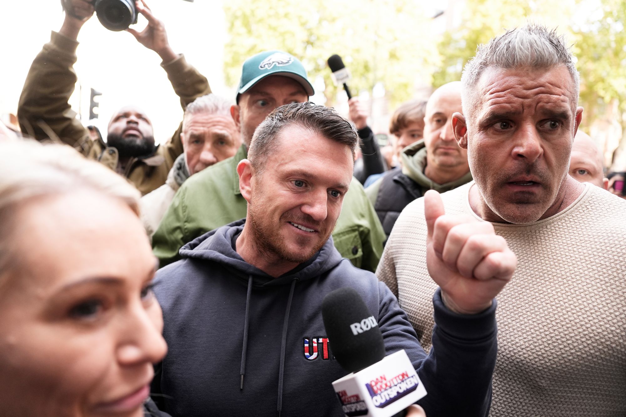 Tommy Robinson (centre), whose real name is Stephen Yaxley-Lennon, arrives at Westminster Magistrates' Court on Tuesday