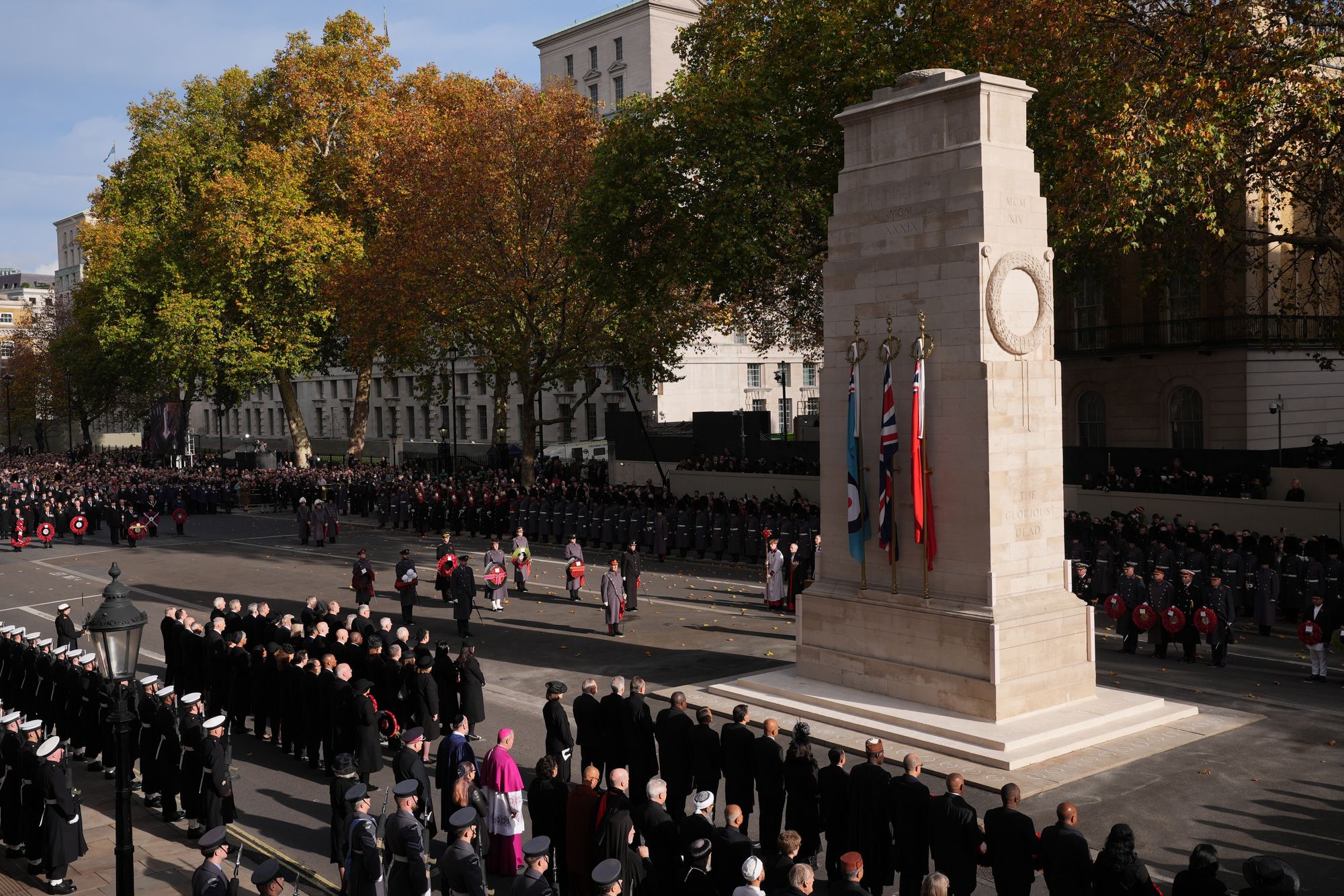 King Charles III (centre) stands during the service at the Cenotaph on Sunday