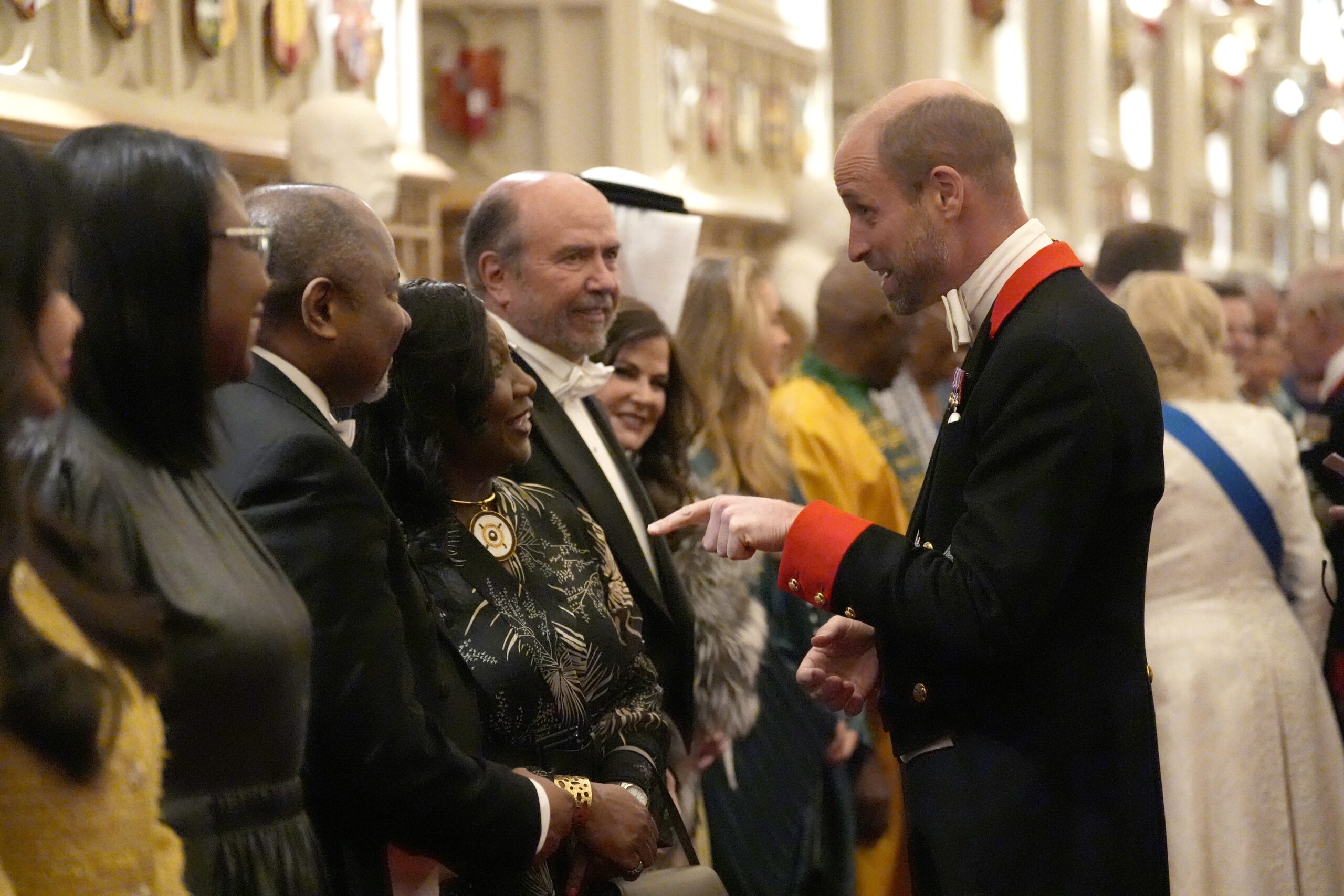 William chatting to guests during the Diplomatic Corps reception (Andrew Matthews/PA)