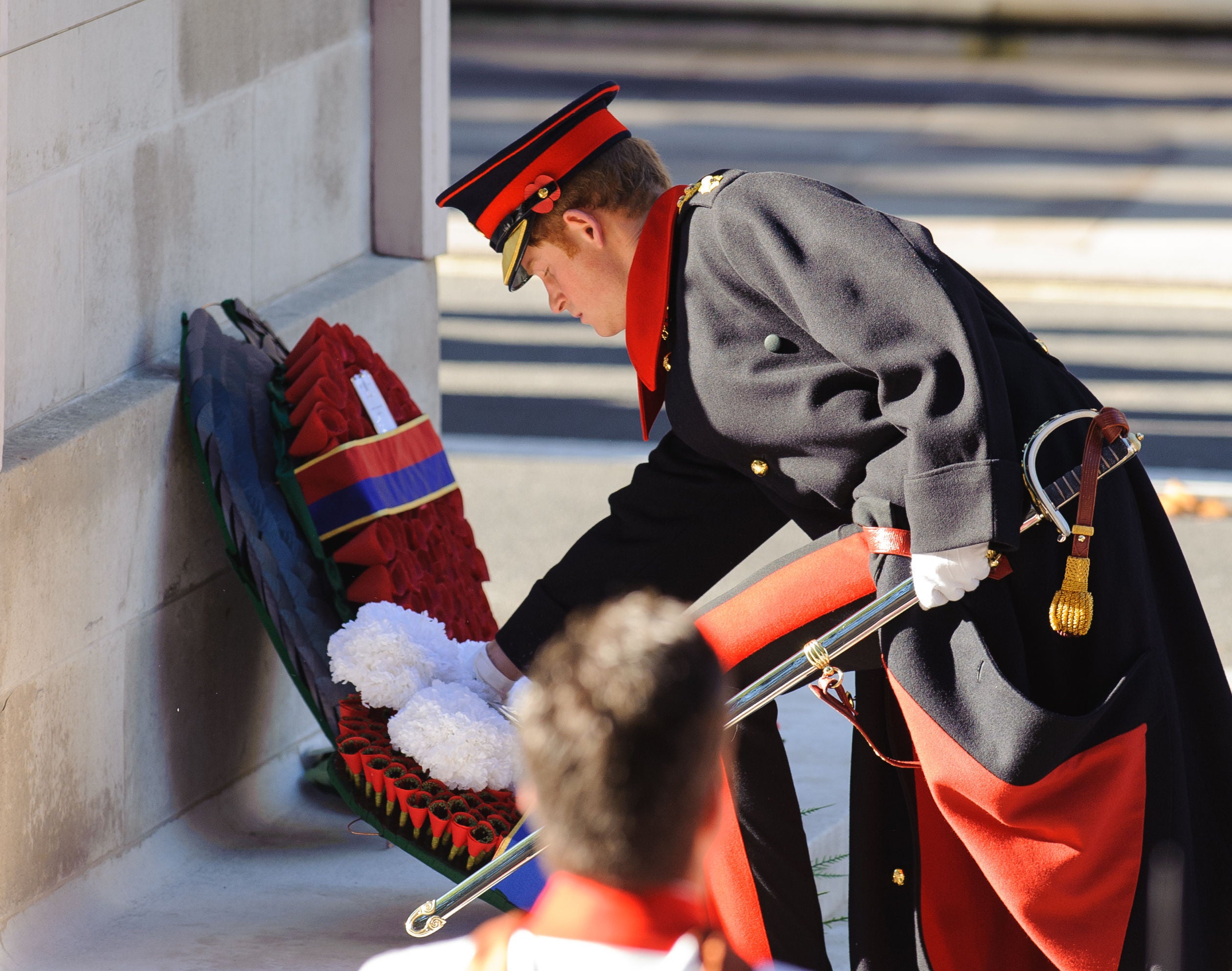 Harry lays a wreath at the Cenotaph memorial in Whitehall on Remembrance Sunday in 2013 (Dominic Lipinski/PA)