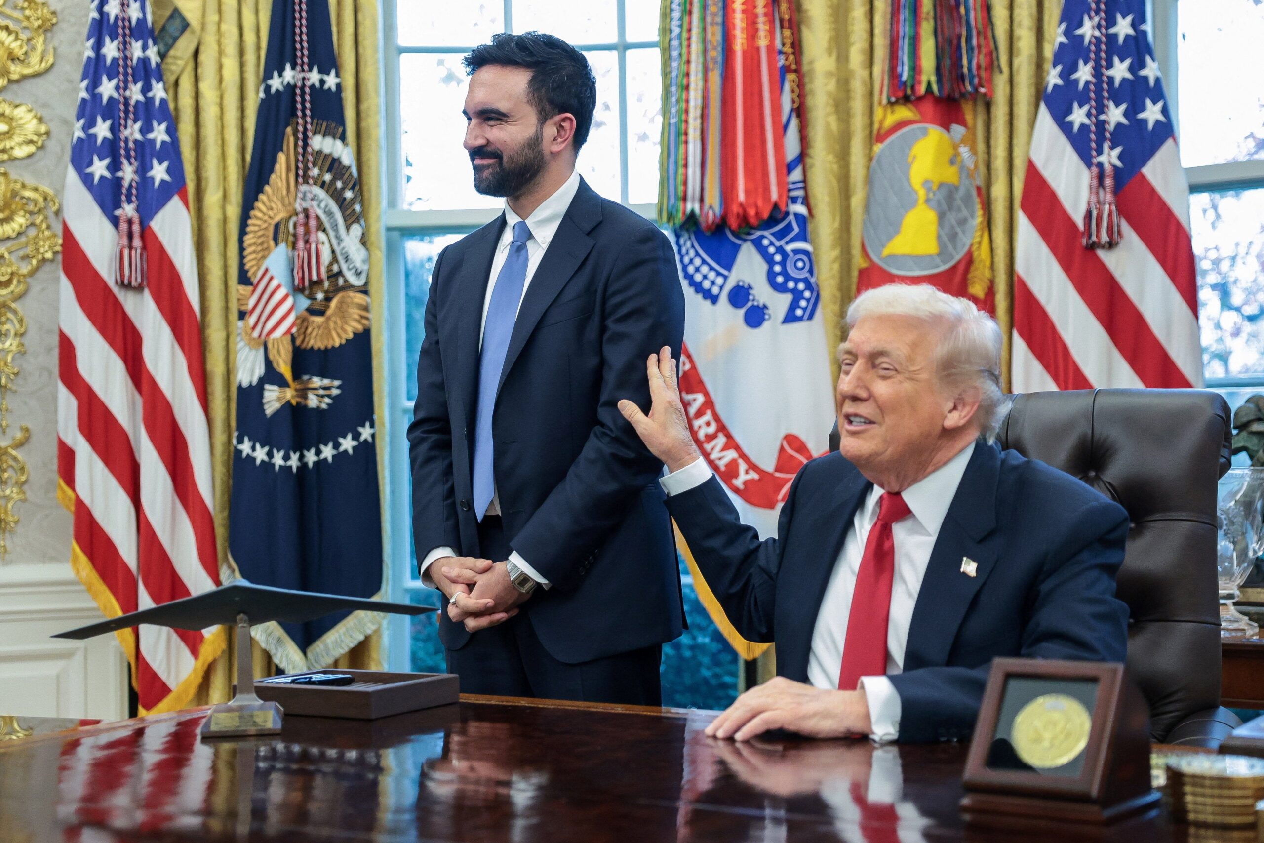 U.S. President Donald Trump and New York City Mayor-elect Zohran Mamdani speak to members of the media as they meet in the Oval Office at the White House in Washington, D.C., U.S., November 21, 2025. REUTERS/Jonathan Ernst