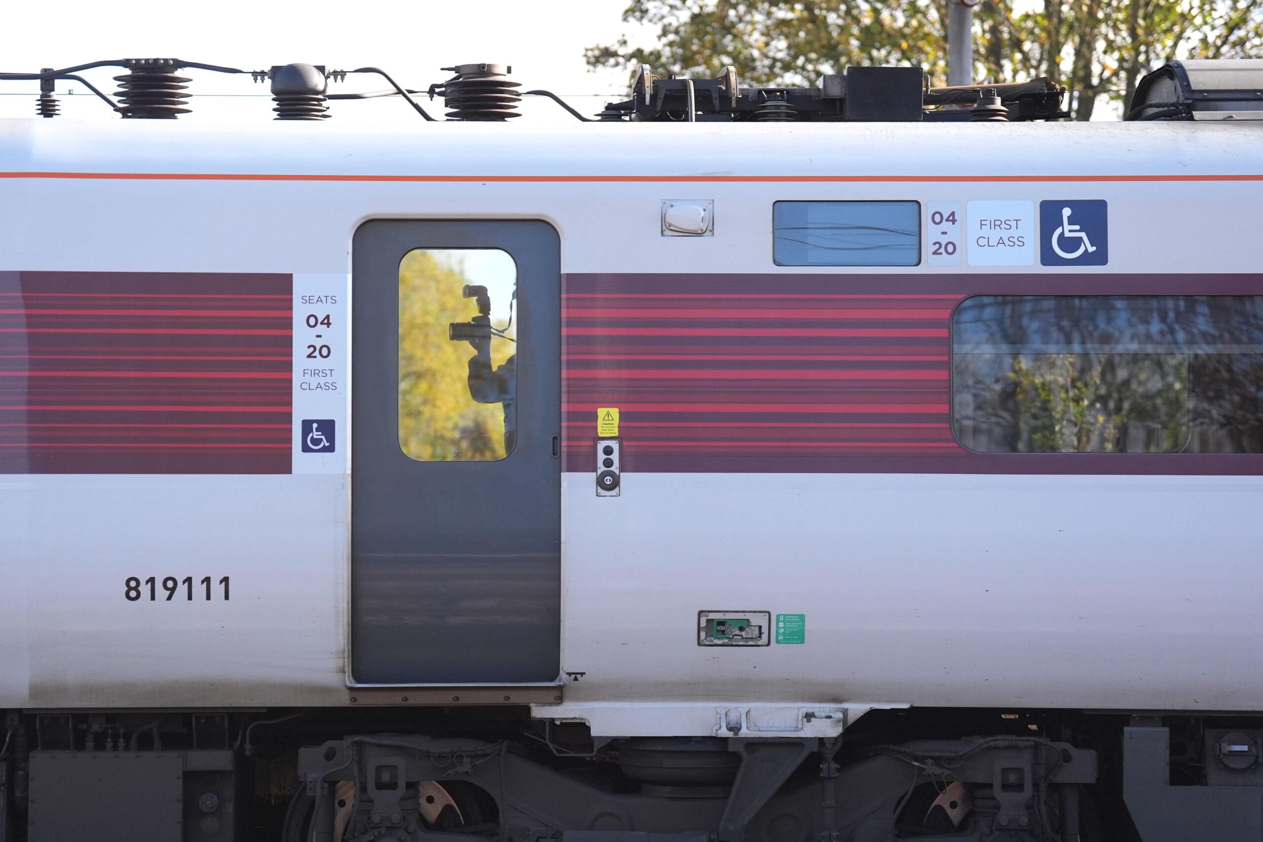 A forensic investigator photographing inside the train at Huntingdon train station