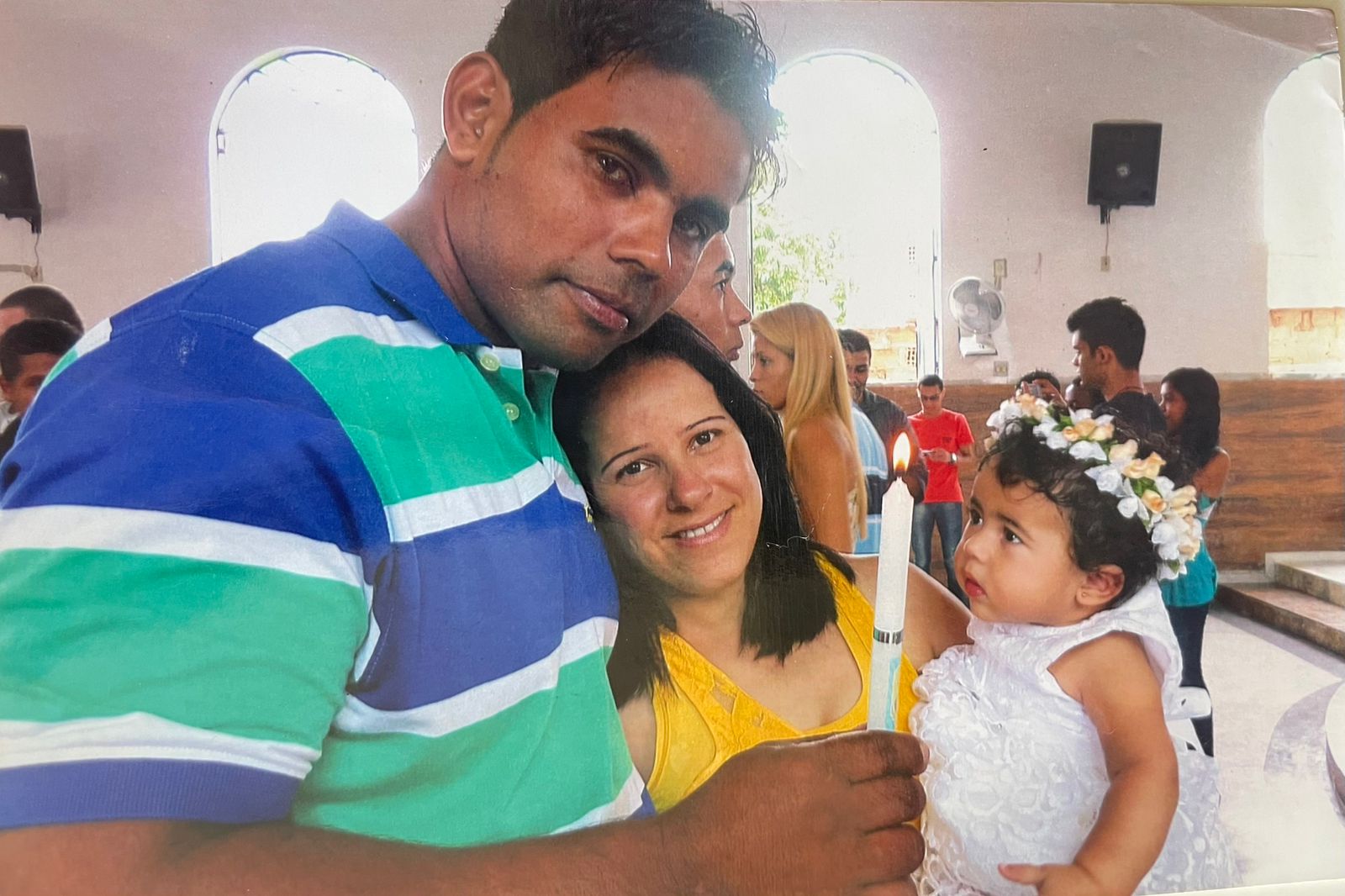 Alinne Ribeiro pictured with her husband, Samuel, and their daughter who is now 12