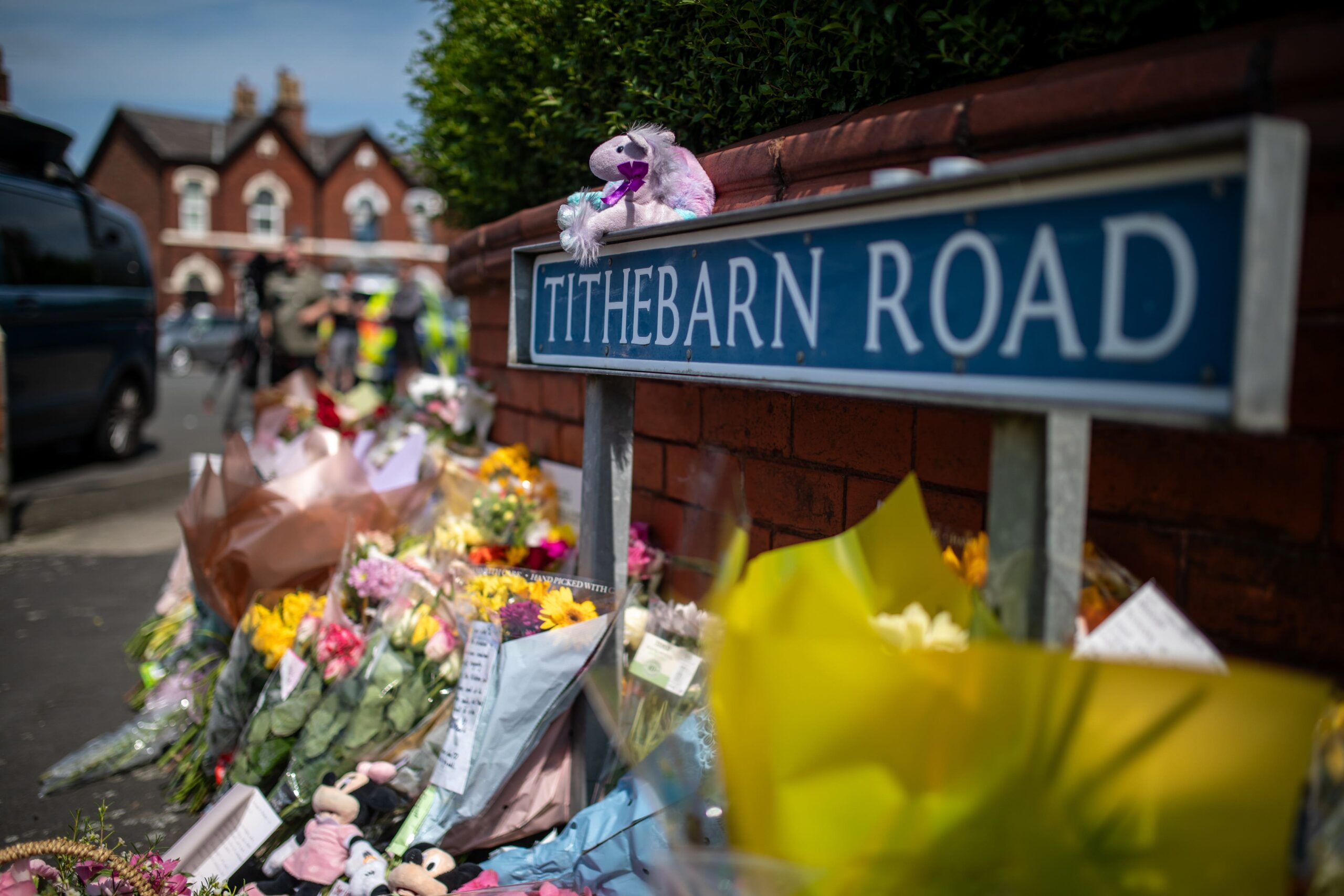 Flowers and tributes near the scene in Hart Street, Southport, where the three girls died