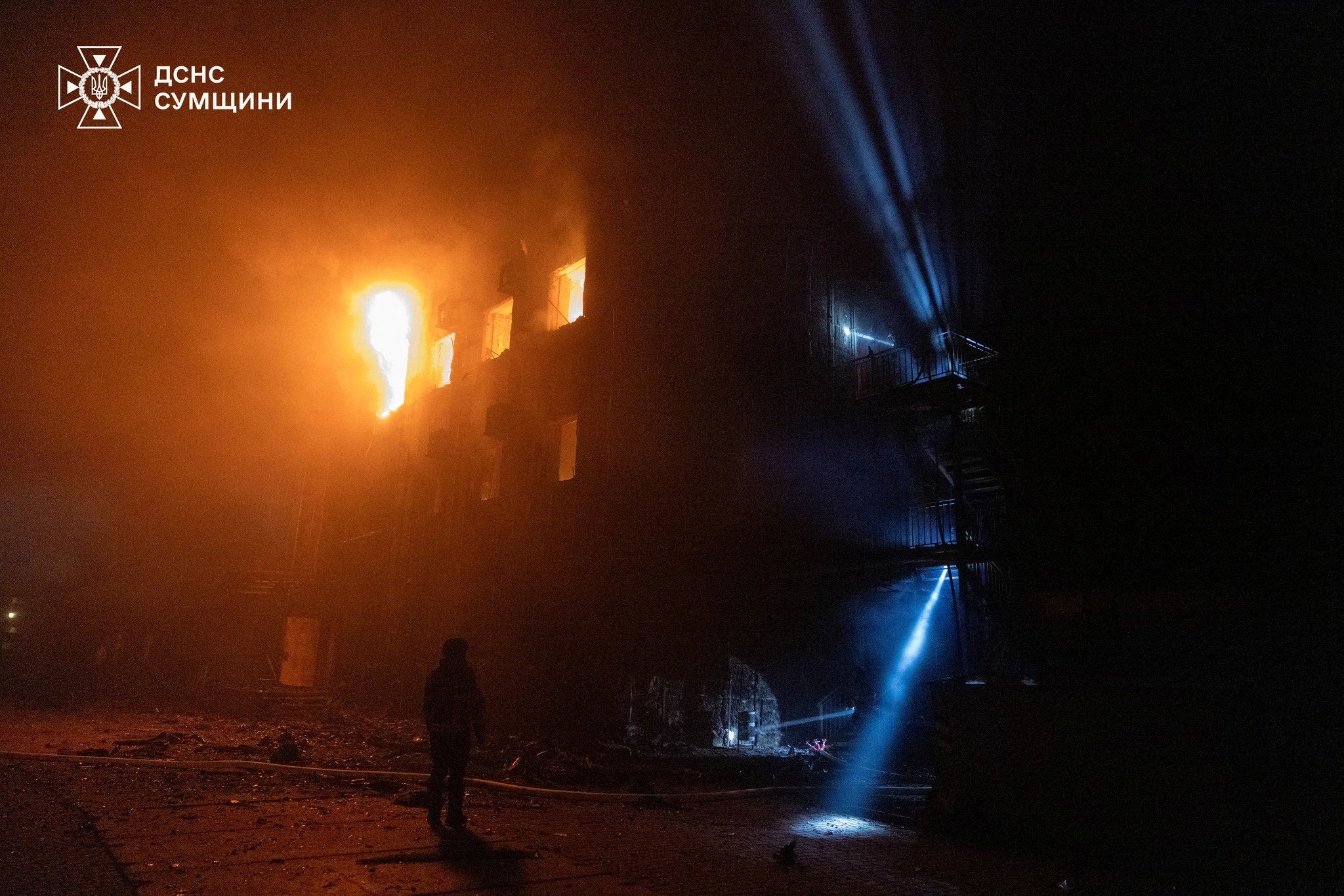 Firefighters work at site of a Russian drone strike in Sumy