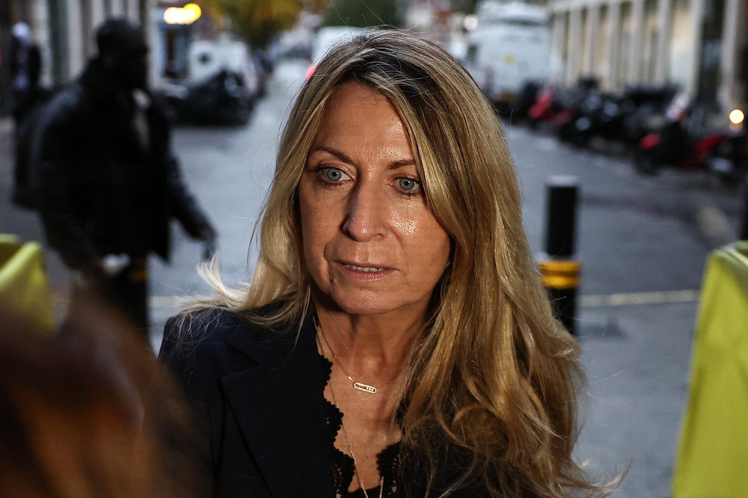 Deborah Turness, who resigned the day before as BBC News CEO, faces the media as she arrives at the offices of the BBC in London on November 10, 2025