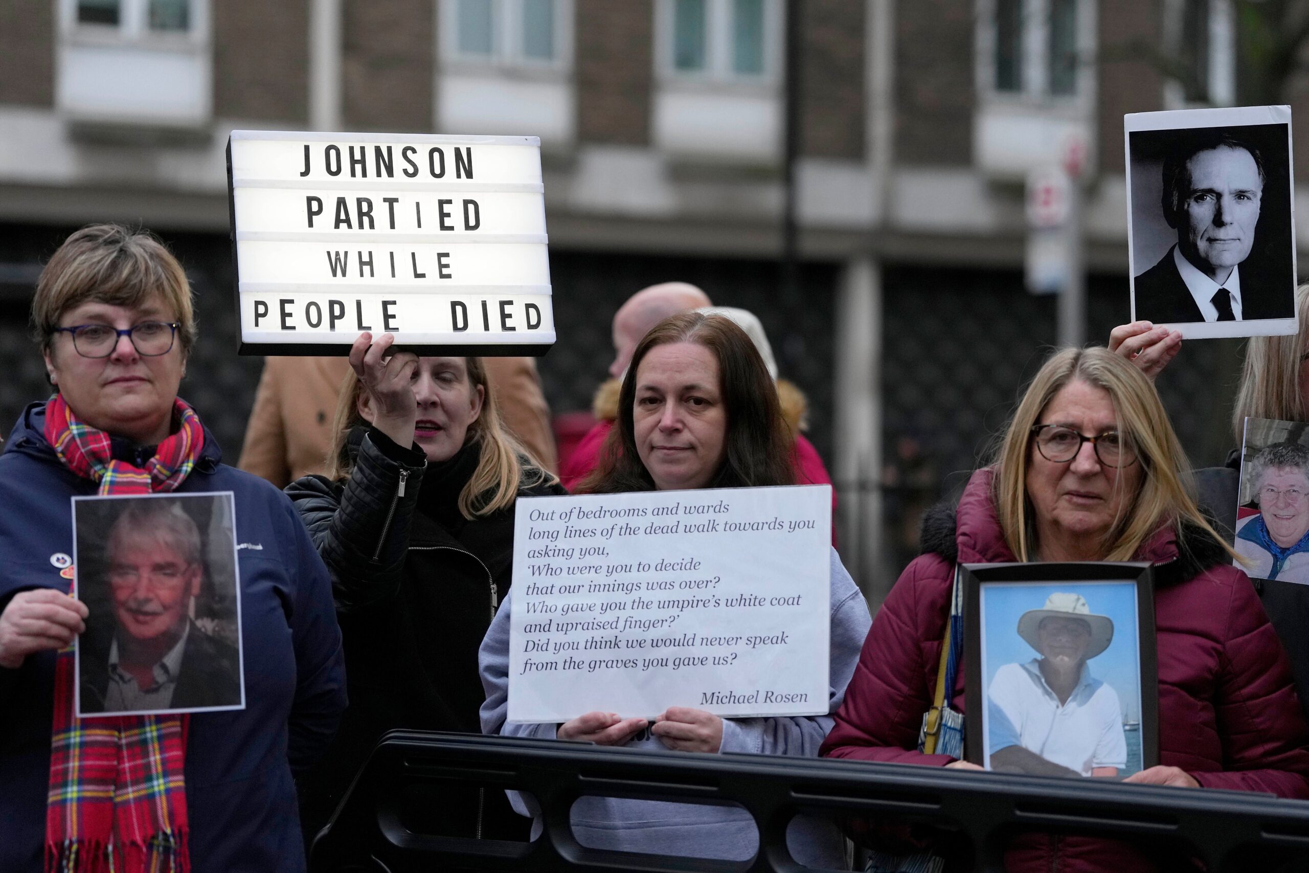 Protesters outside the Covid inquiry when Mr Johnson gave evidence