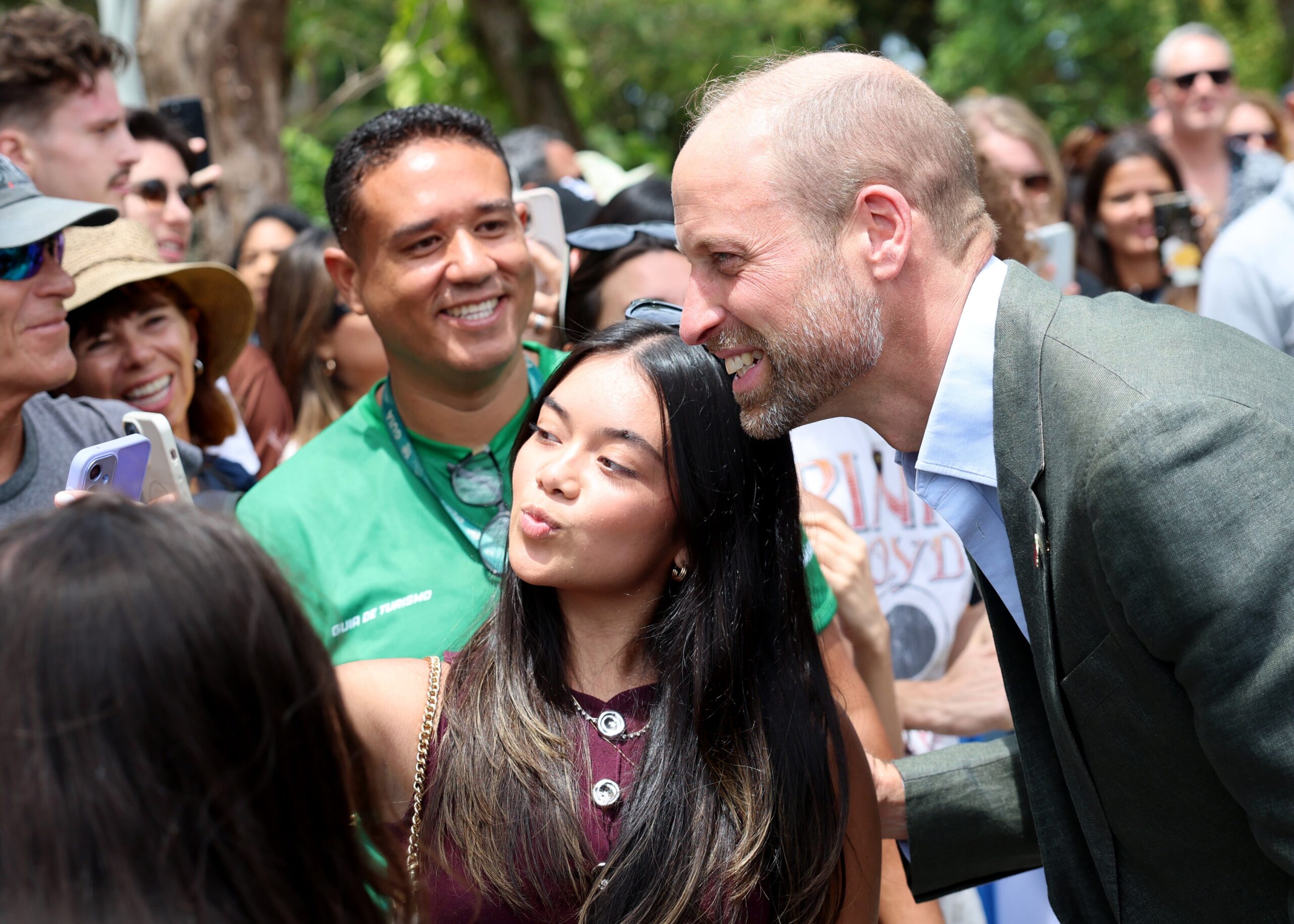 The Prince of Wales poses for pictures with members of the public during a 'Welcome to Rio' event at Sugarloaf Mountain, in Rio de Janeiro