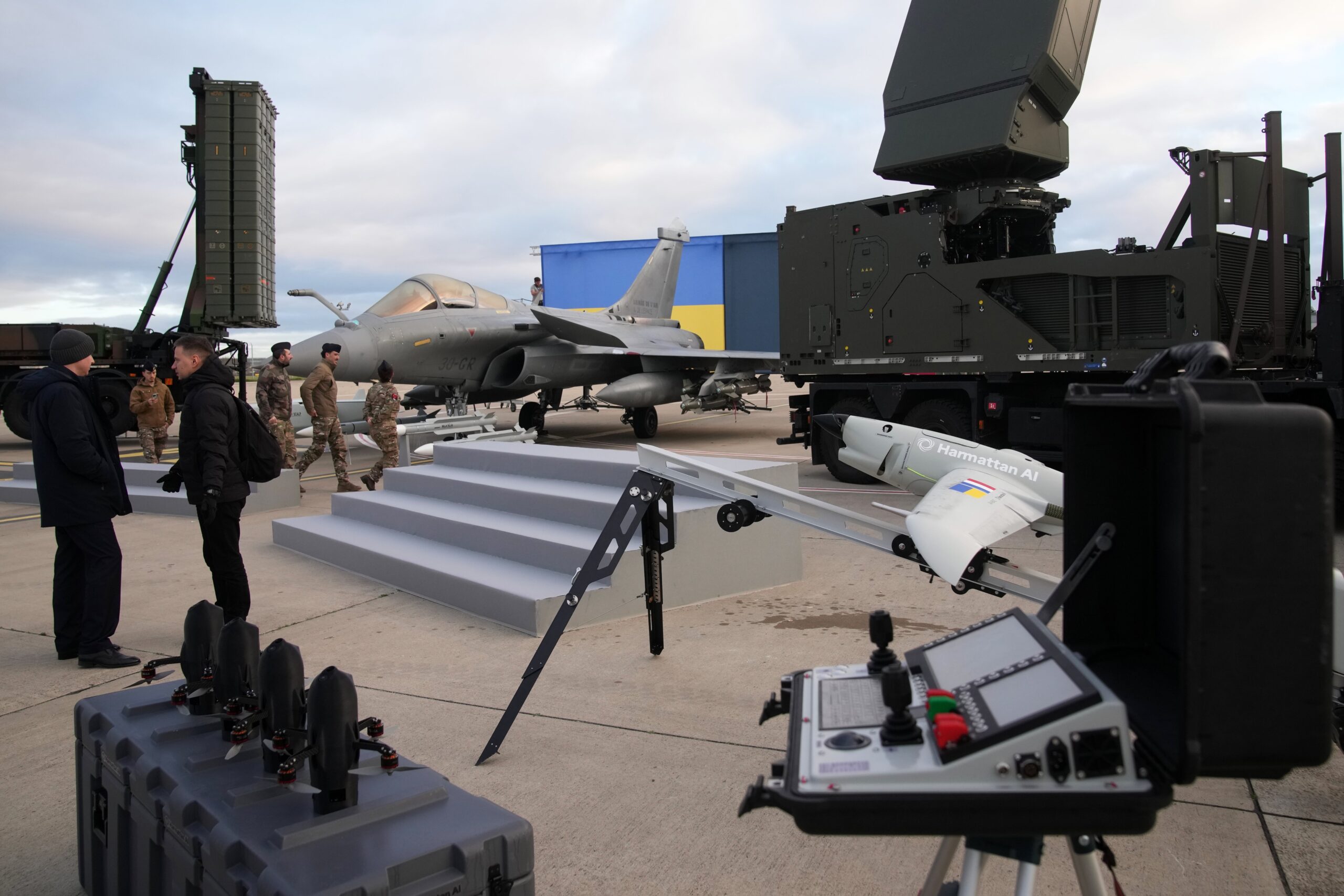 A Rafale jet fighter, drones and ammunitions are seen before the arrival of Ukrainian president Volodymyr Zelensky at the Villacoublay air base near Paris