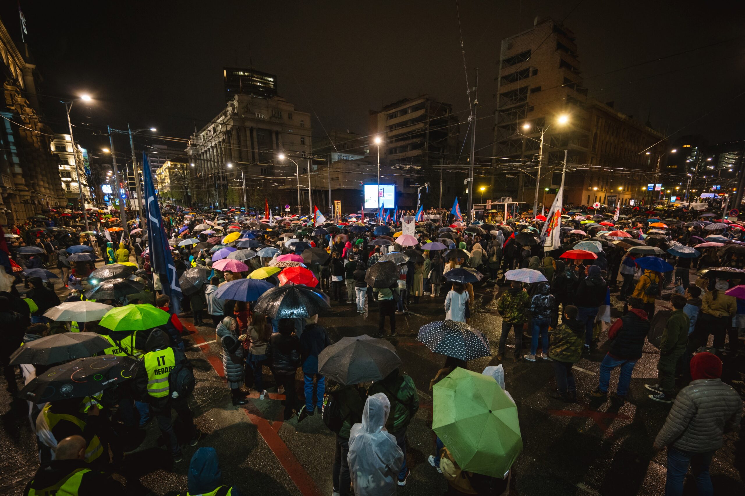 Protesters gathering in front of the bomb-damaged former Yugoslav