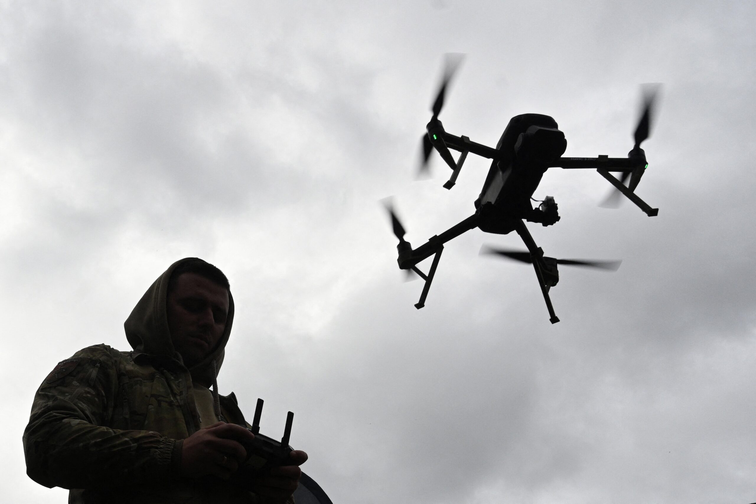 A Ukrainian serviceman operates a drone during the 'Wild Drones' drone racing competition, which simulates combat conditions, in Kamianets-Podilskyi, Khmelnytsky region on October 5, 2025, amid the Russian invasion of Ukraine