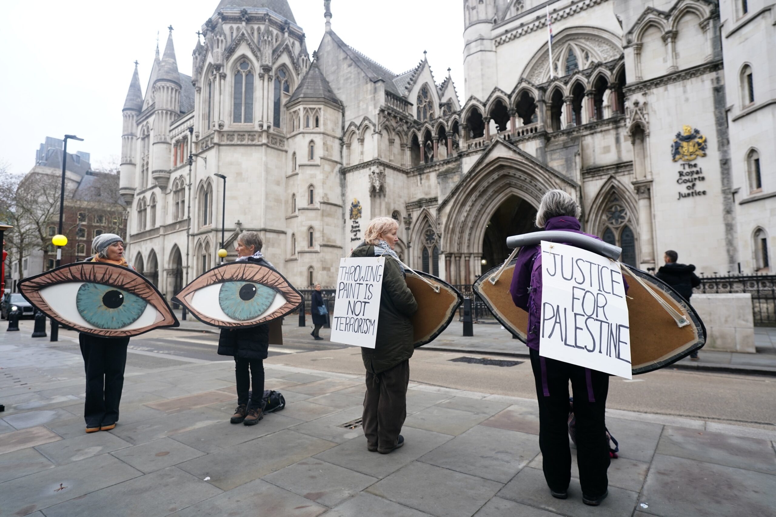 Campaigners outside the Royal Courts of Justice, central London, where Palestine Action co-founder Huda Ammori is taking legal action against the Home Office's decision to proscribe the group under anti-terror laws.