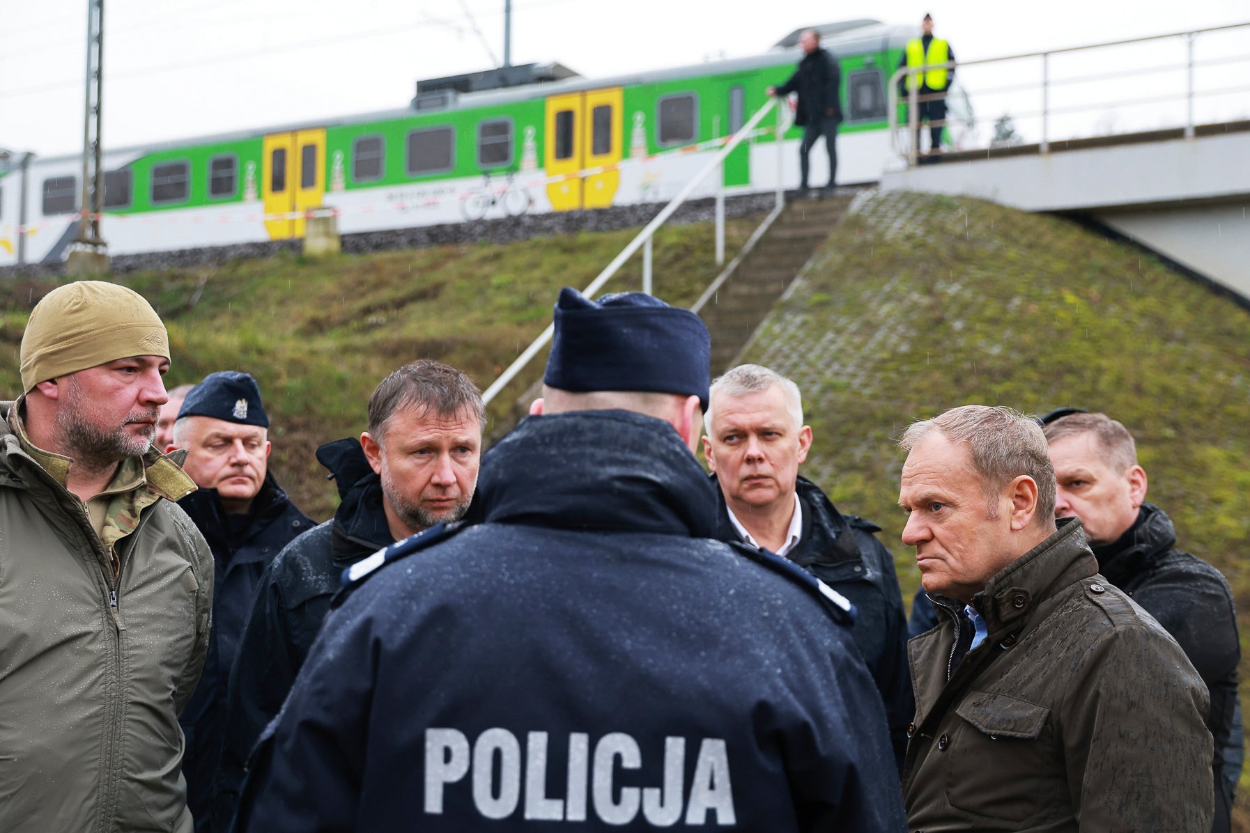 Prime Minister Donald Tusk, second right, visits site of the rail line Mika, that was damaged by sabotage, near Deblin