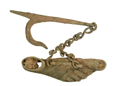A Roman alloy lamp in the shape of a foot was discovered in Kent in 2024
